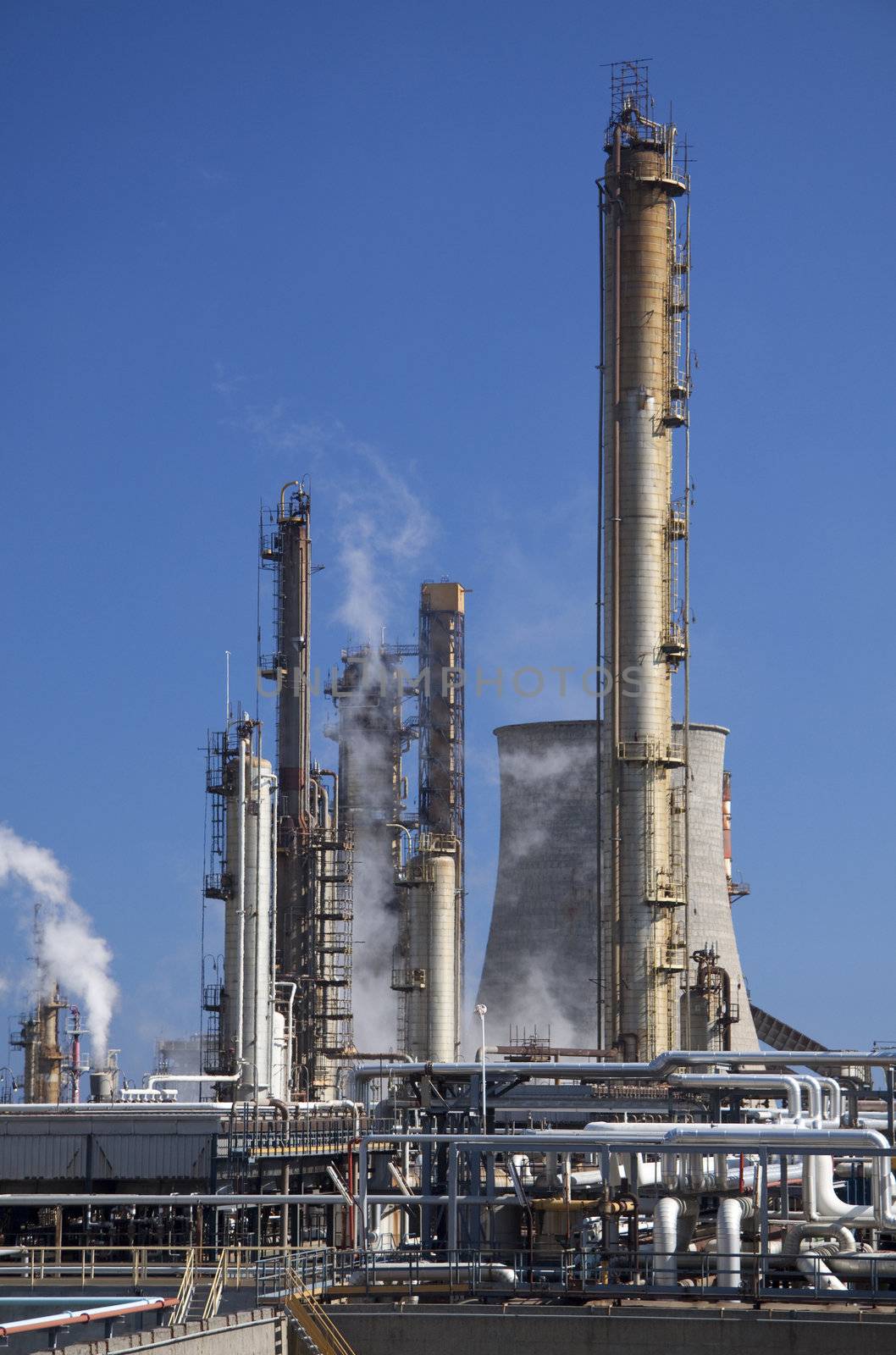 Oil refinery in Italy Milazzo Sicily with tall smokestacks