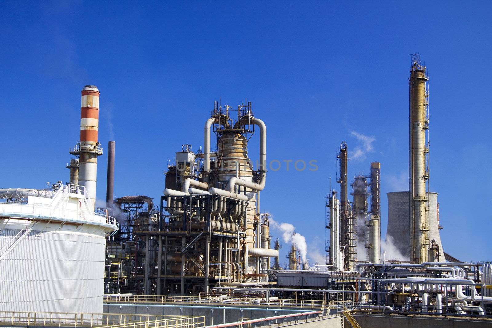 Oil refinery in Italy Milazzo Sicily with tall smokestacks