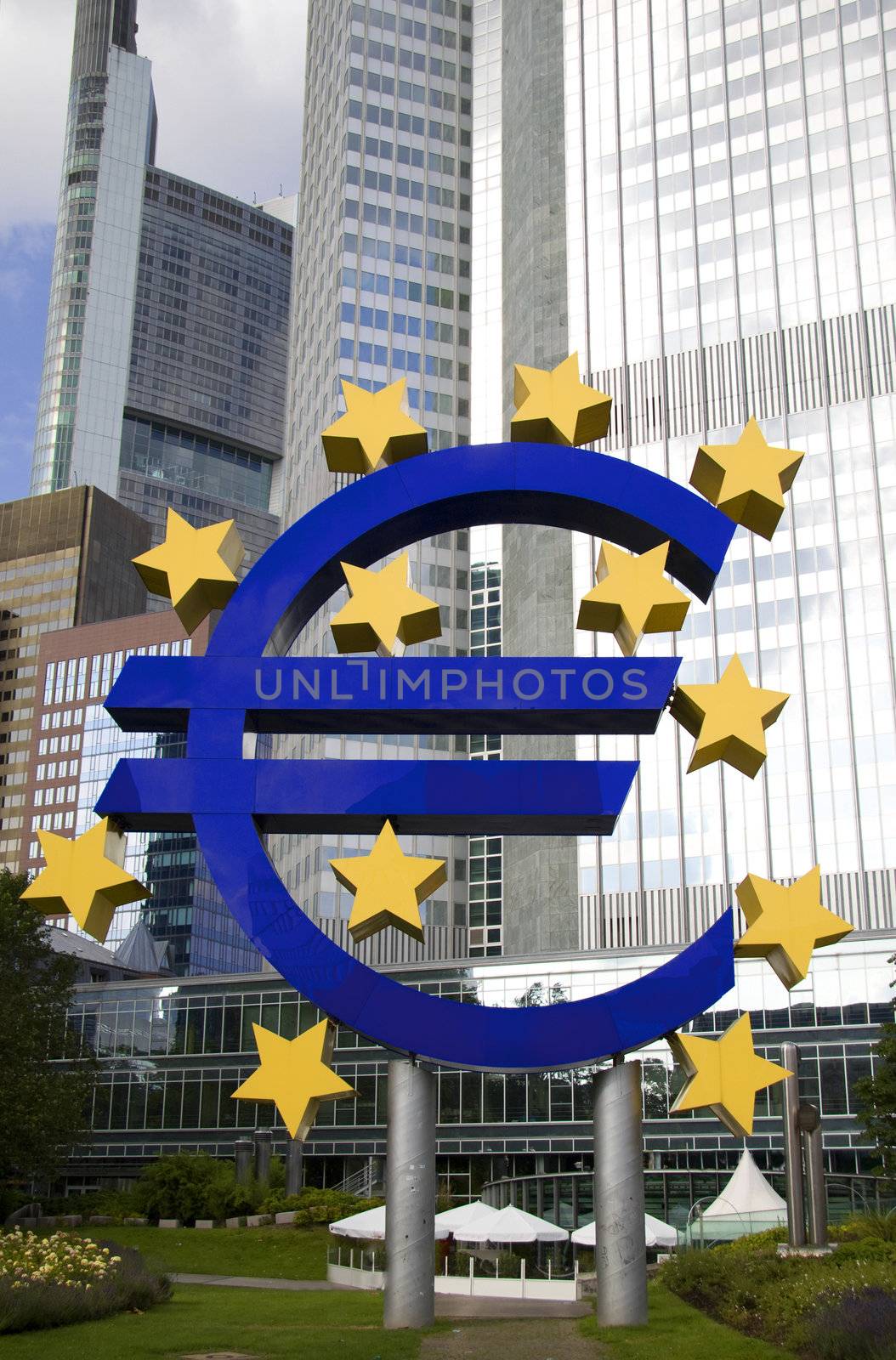 European Currency symbol in Frankfurt in front of skyline