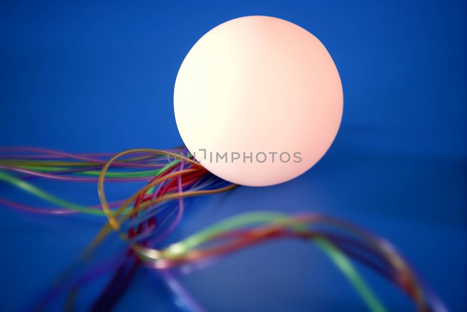 Glowing sphere with colorful wires such a wired communication metaphor
