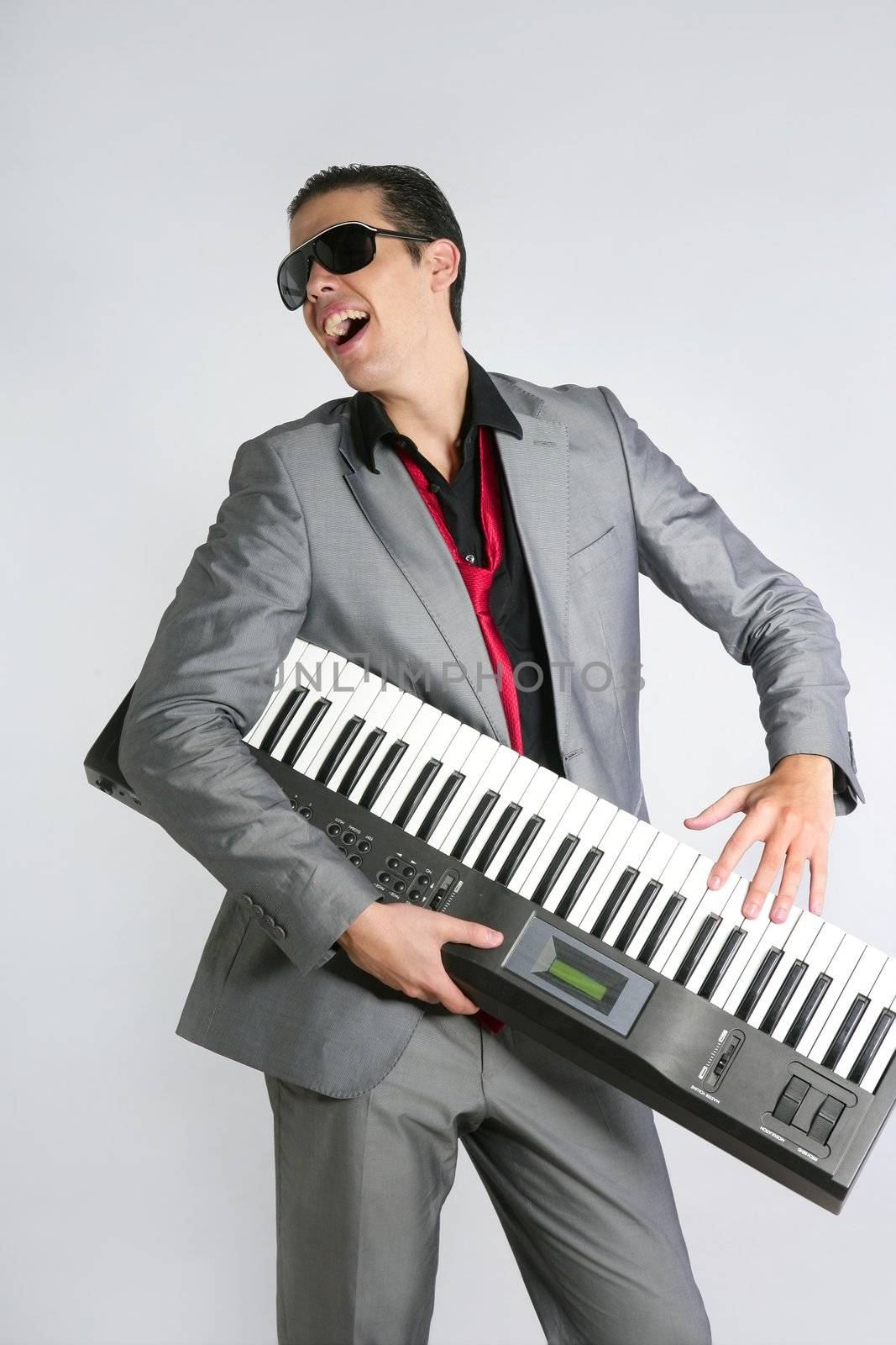 Businessman musician playing instrument with suit and tie