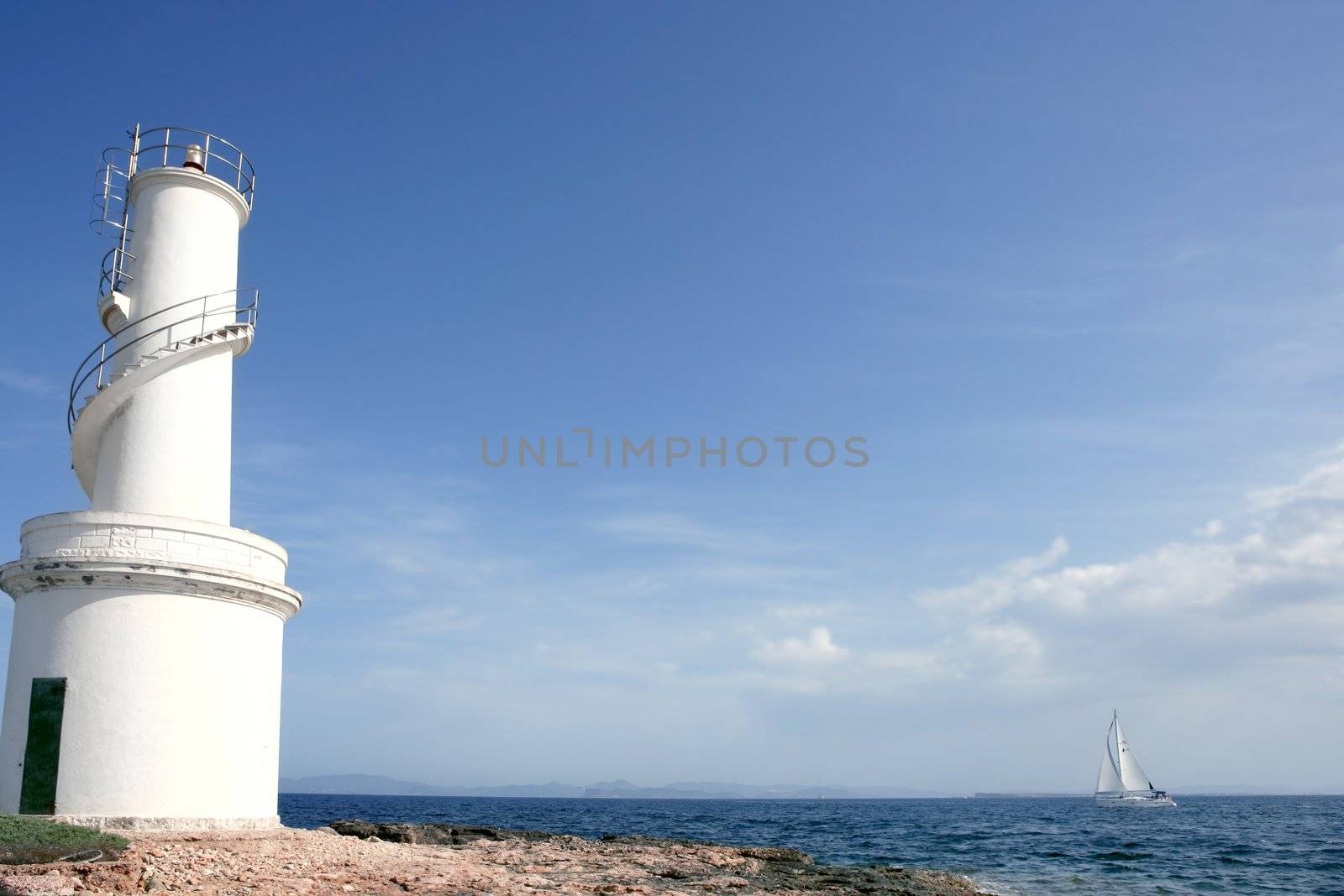 Lighthouse in balearic Islands Formentera blue sea and sky