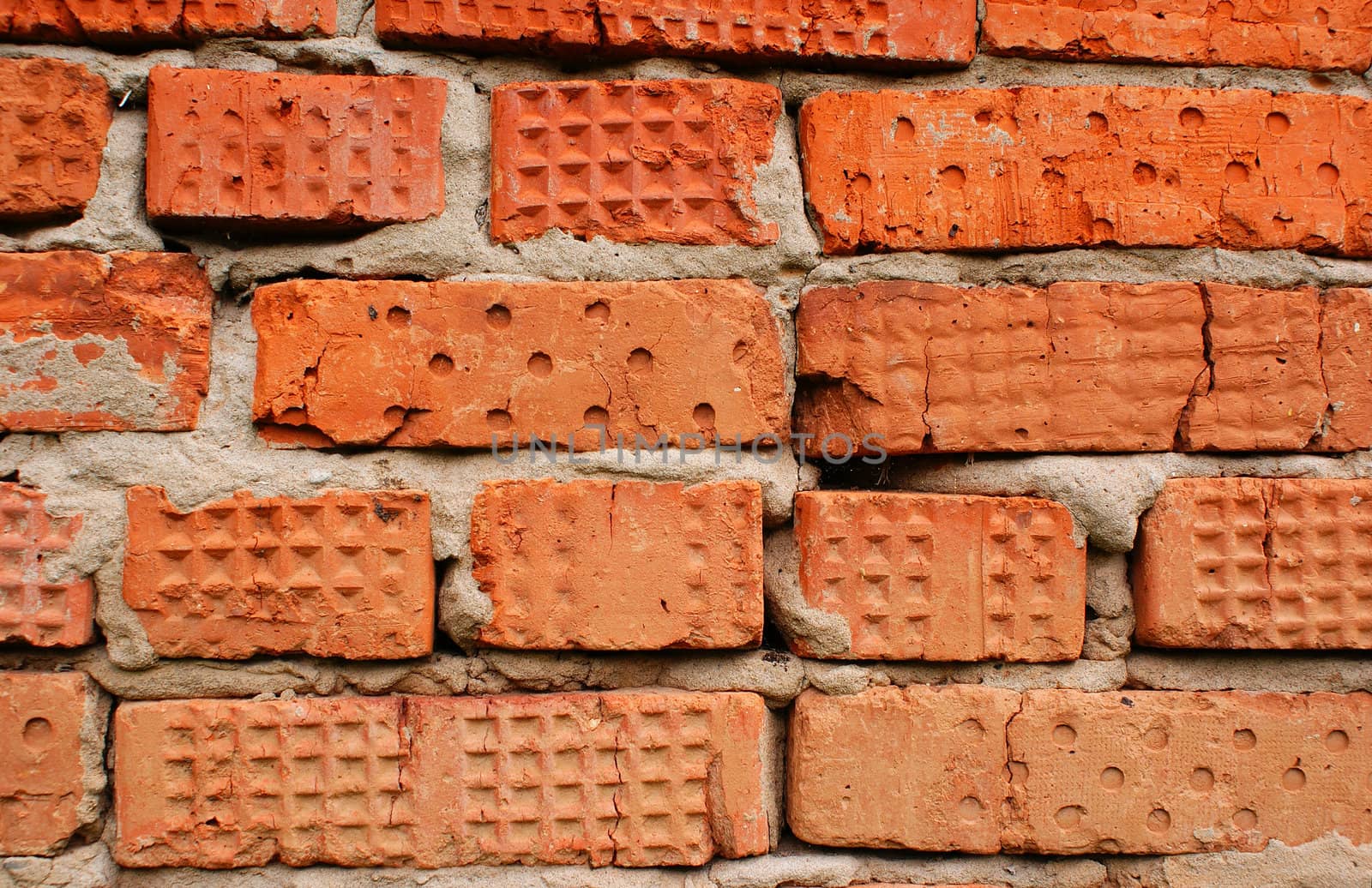 Wall made of old red bricks