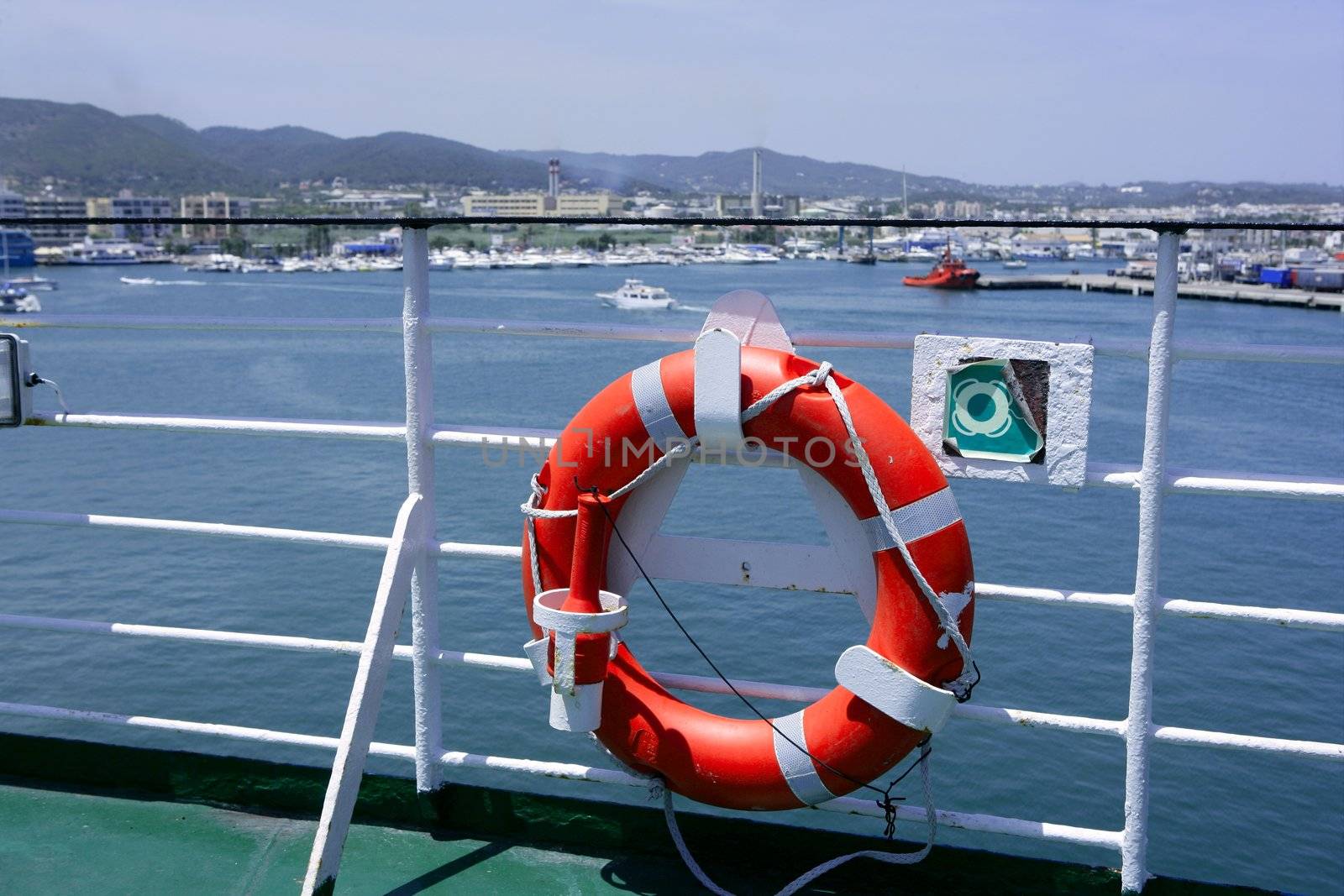 Cruise white boat handrail in blue Ibiza sea and round orange buoy