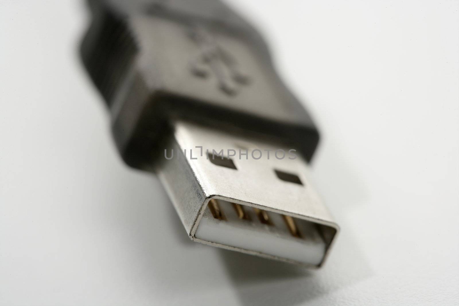 USB connection plug macro detail closeup over white background