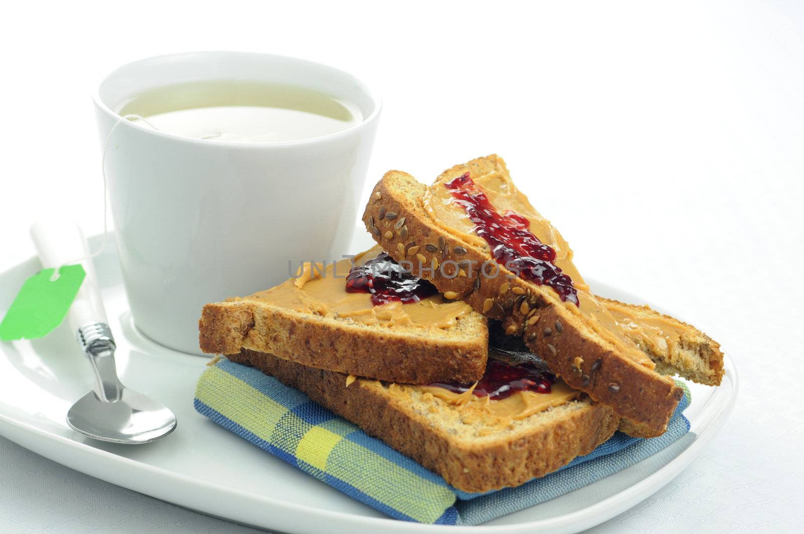 Toast, peanut butter and Jam with a cup of tea.