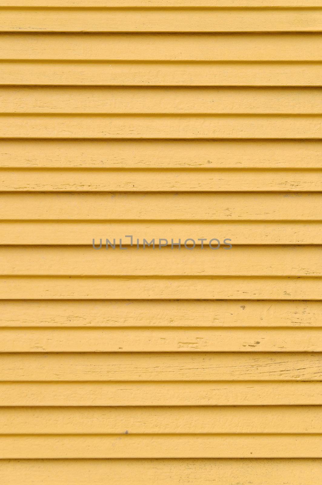 closeup detail of wooden yellow blinds - vertical shot