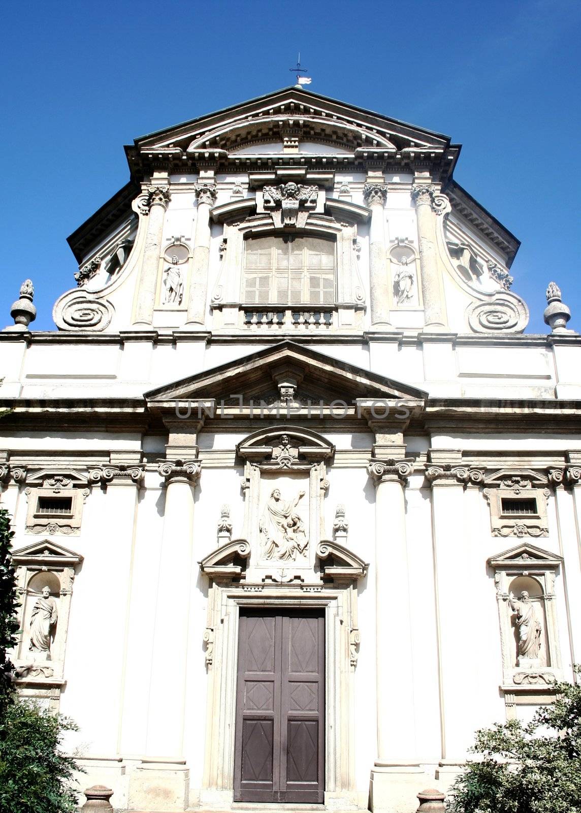 Church white facade, Milan, Italy