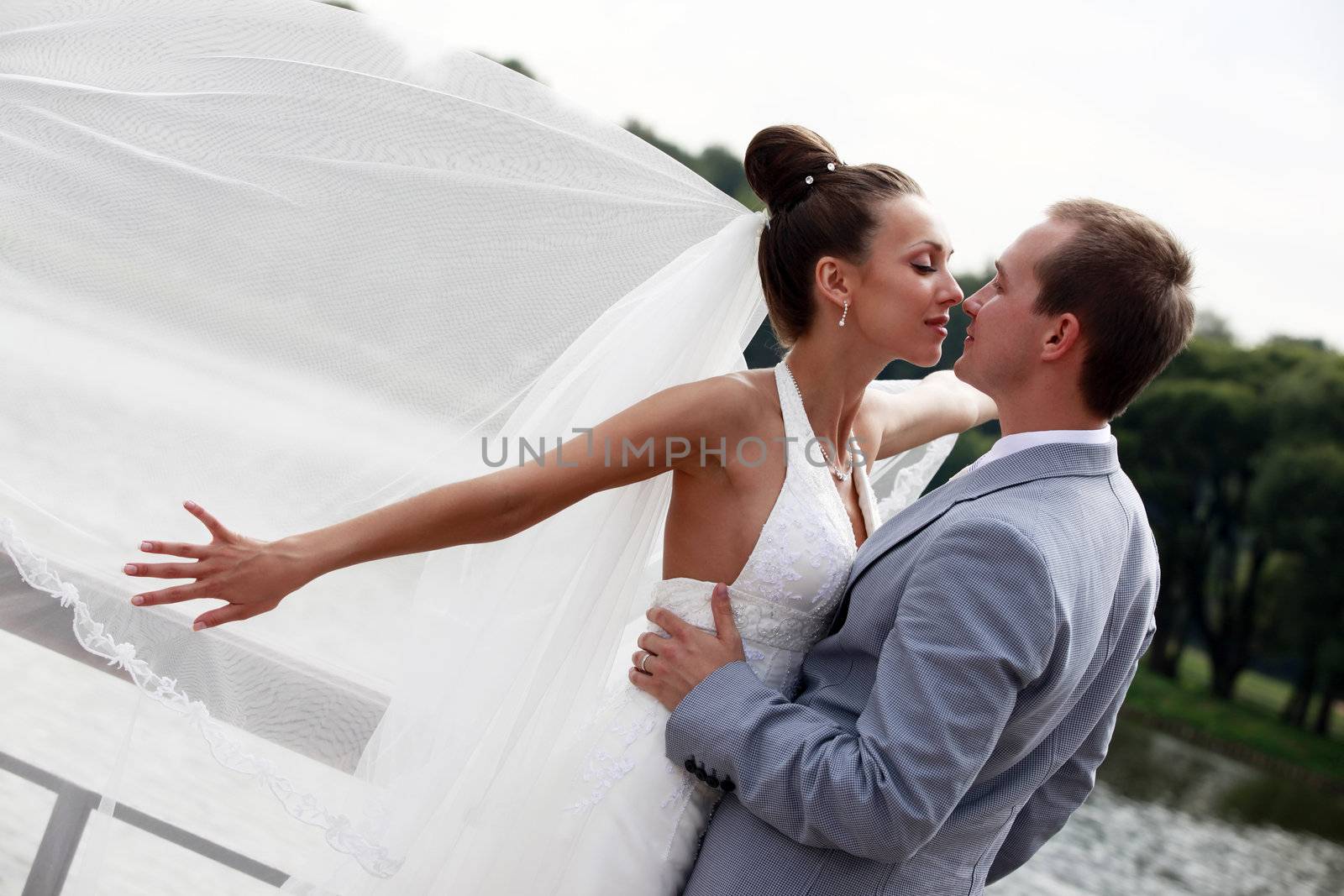 Newly-married couple in park