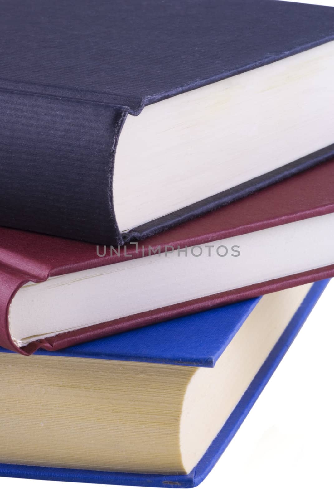 Close up of three books isolated on a white background.