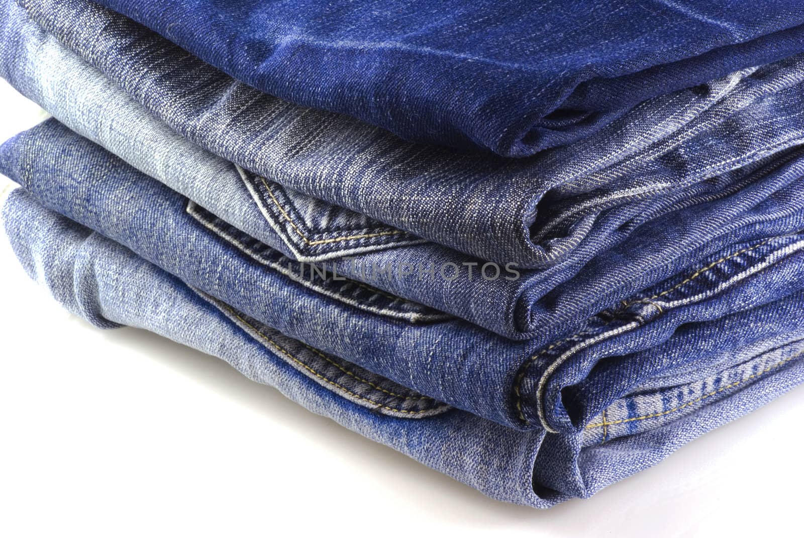 Stack of jeans. by SasPartout