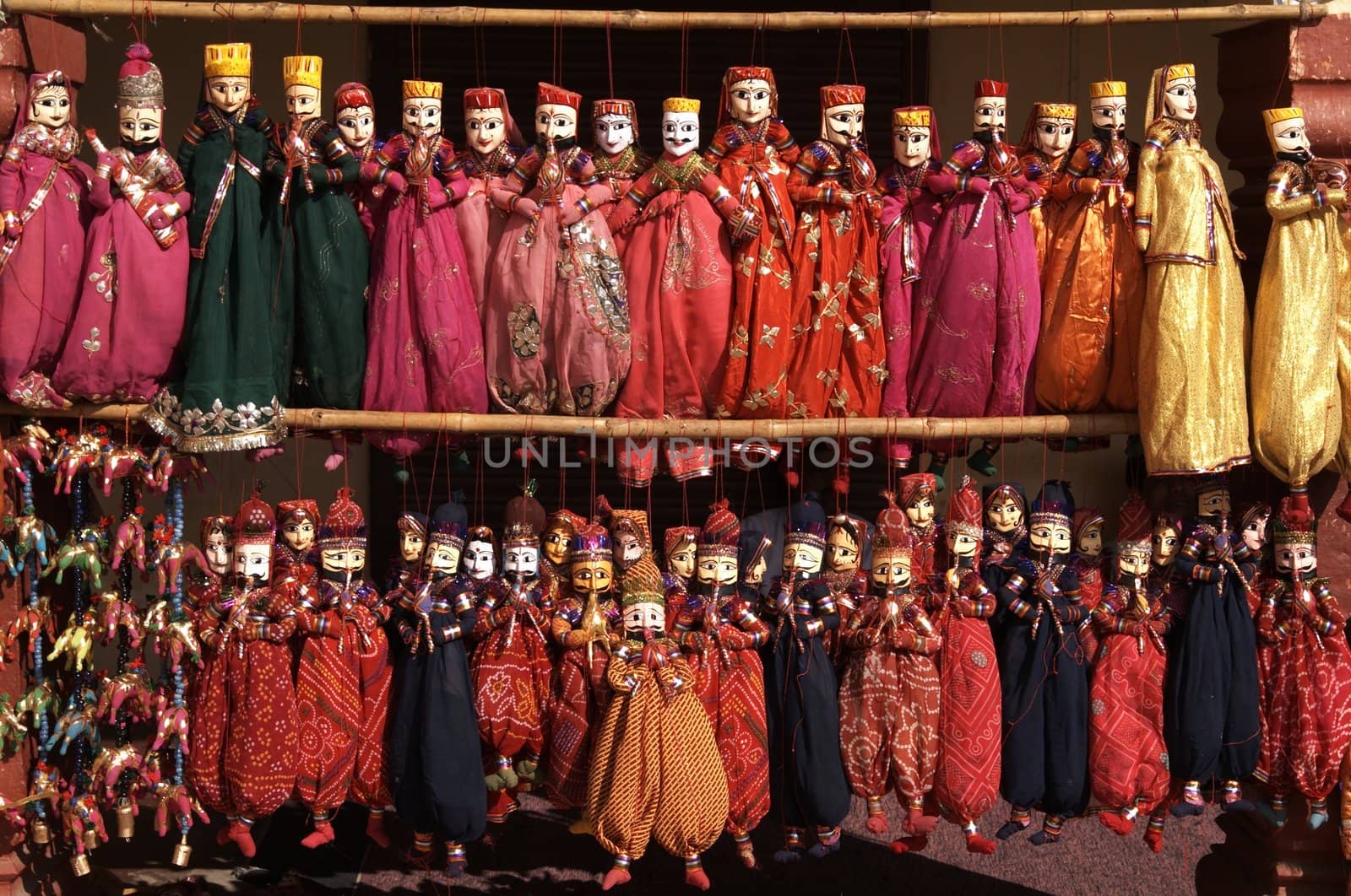 Rows of colorful puppets for sale in Jaipur, Rajasthan, India