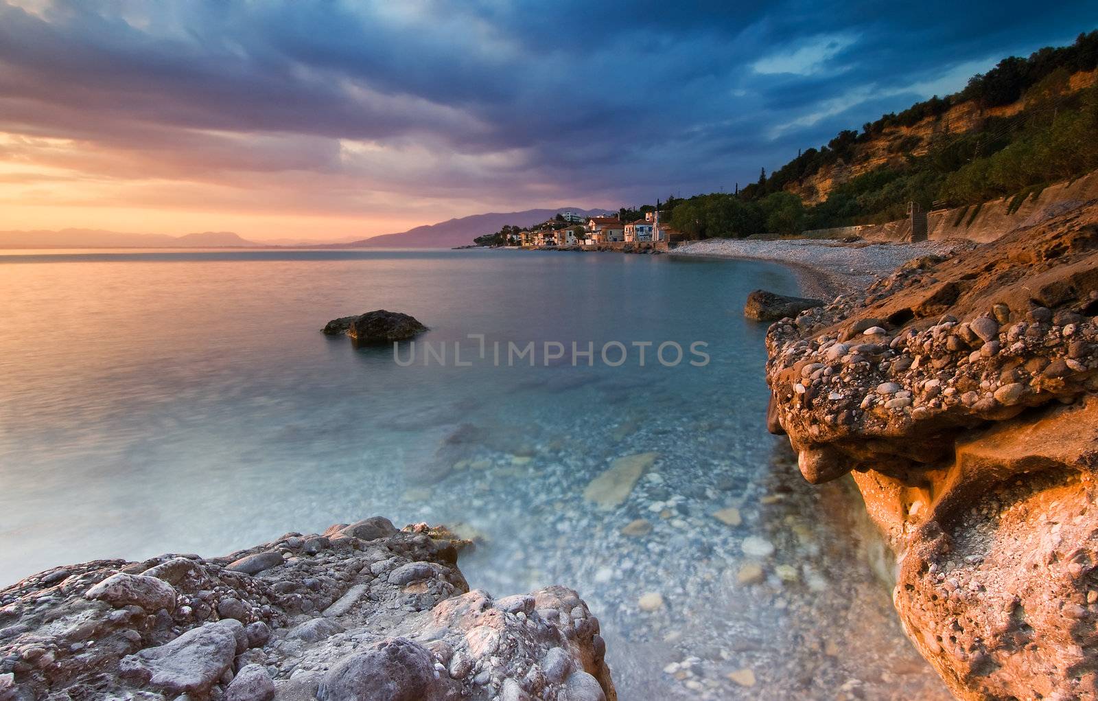 The beach at the fishing village of Akrogiali, southern Greece, photographed during sunset