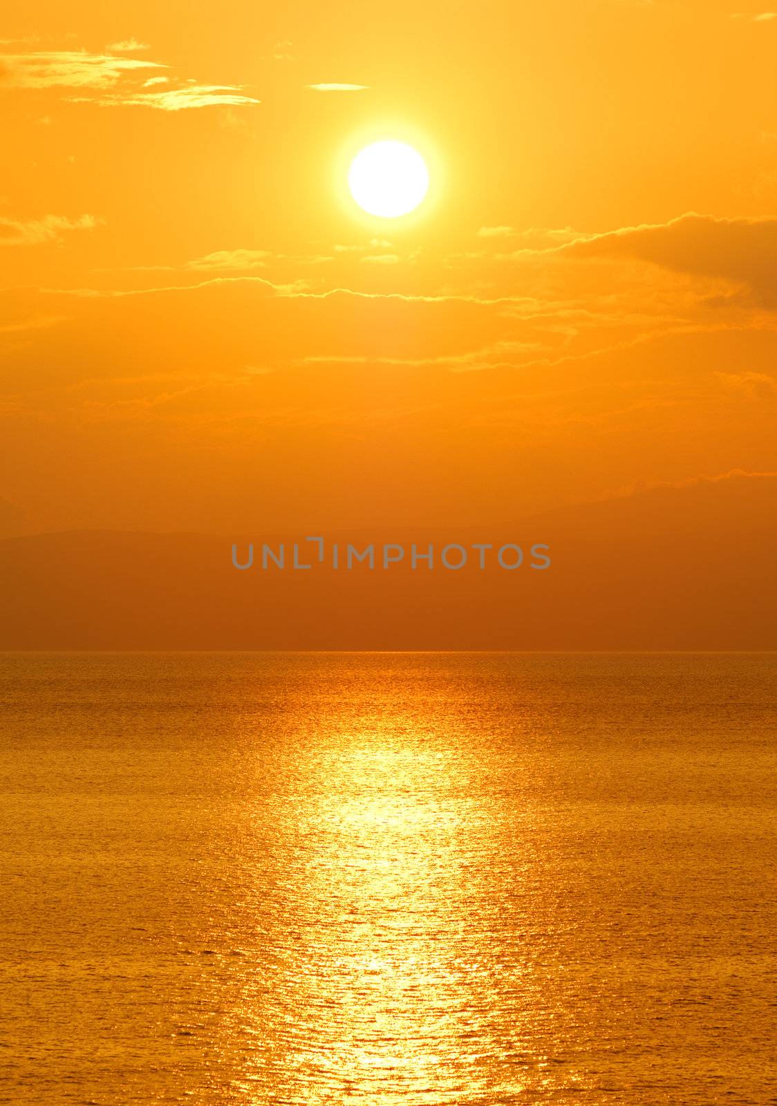 Image shows the sun setting over the Mediterranean Sea