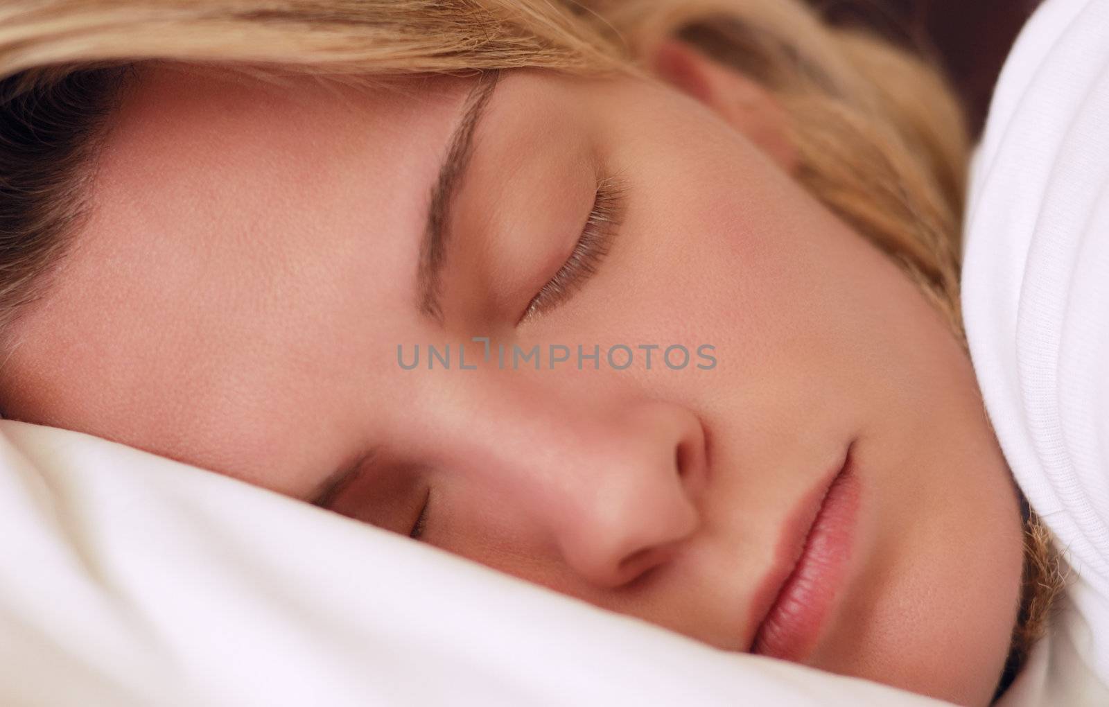 Beautiful young woman sleeping by akarelias