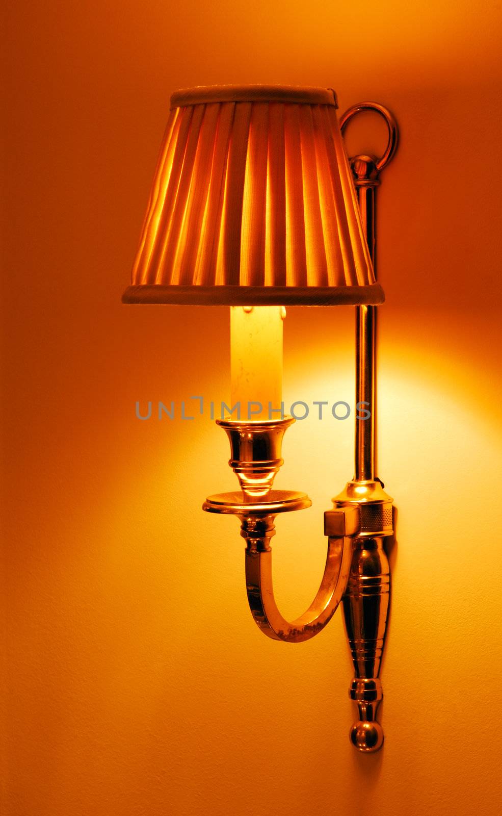 Image shows a lighted sconce delivering warm indoor lighting	
