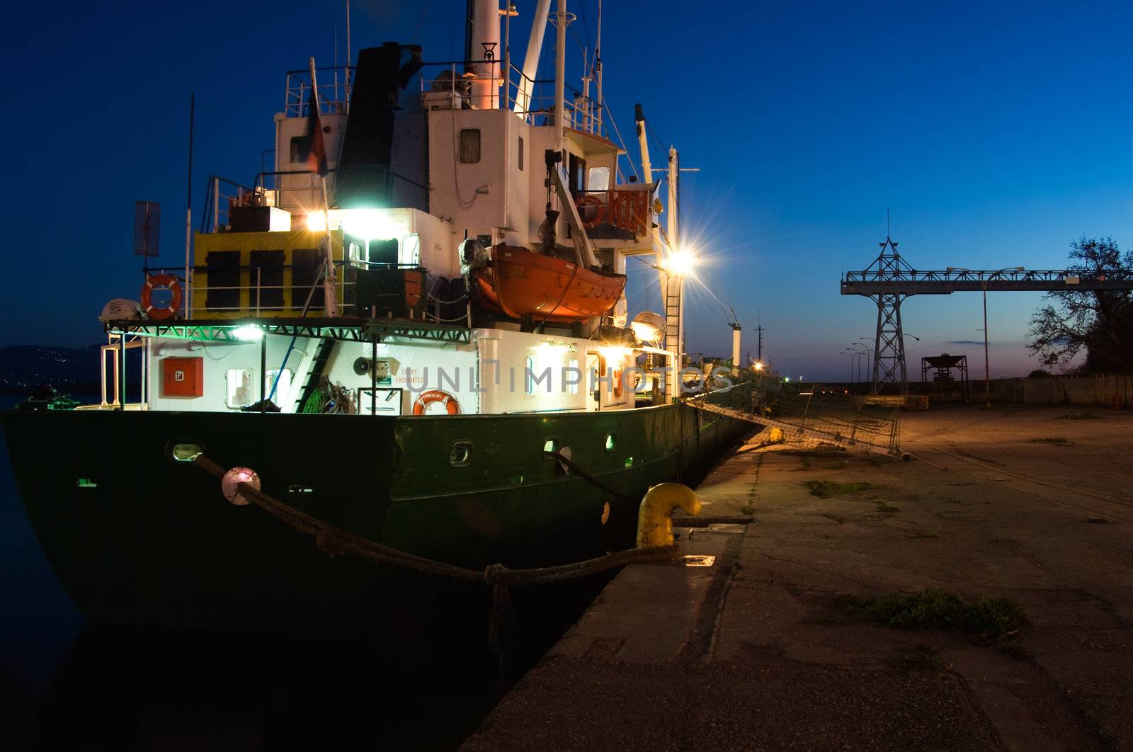 Image shows a ship moored in the harbor of Kalamata, southern Greece