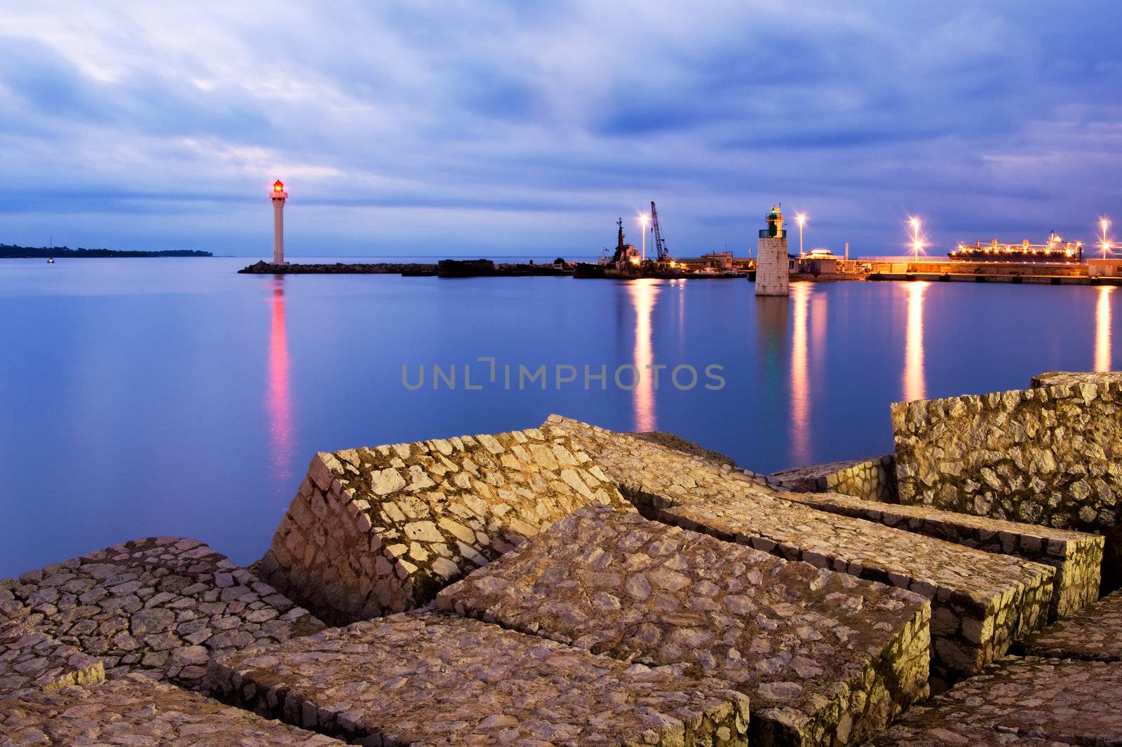 Image shows the entrance of the Vieux Port in the city of Cannes, French Riviera