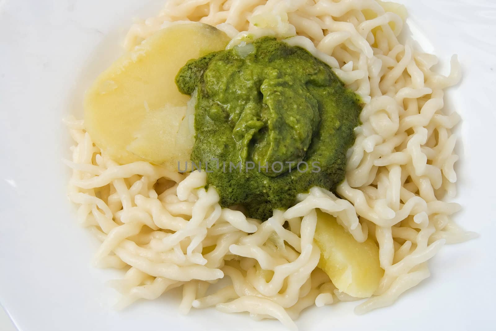 Trofie with pesto is a typical Ligurian food often accompanied by potatoes or green beans. Pesto is a sauce made of basil, parmesan and pine nuts