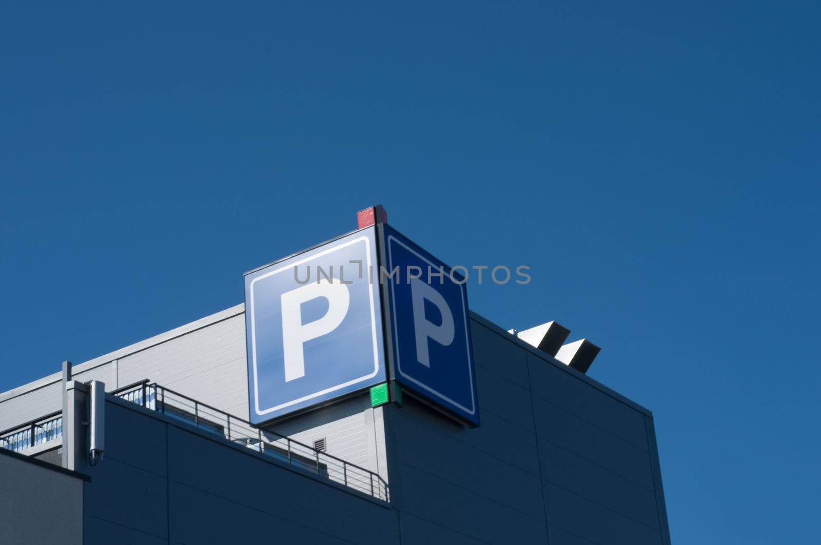 Parking sign on the morden building in the city