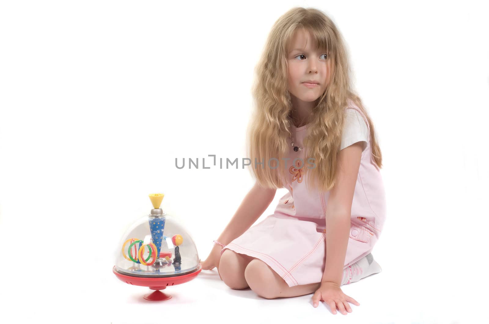 Shot of little girl playing with toy in studio