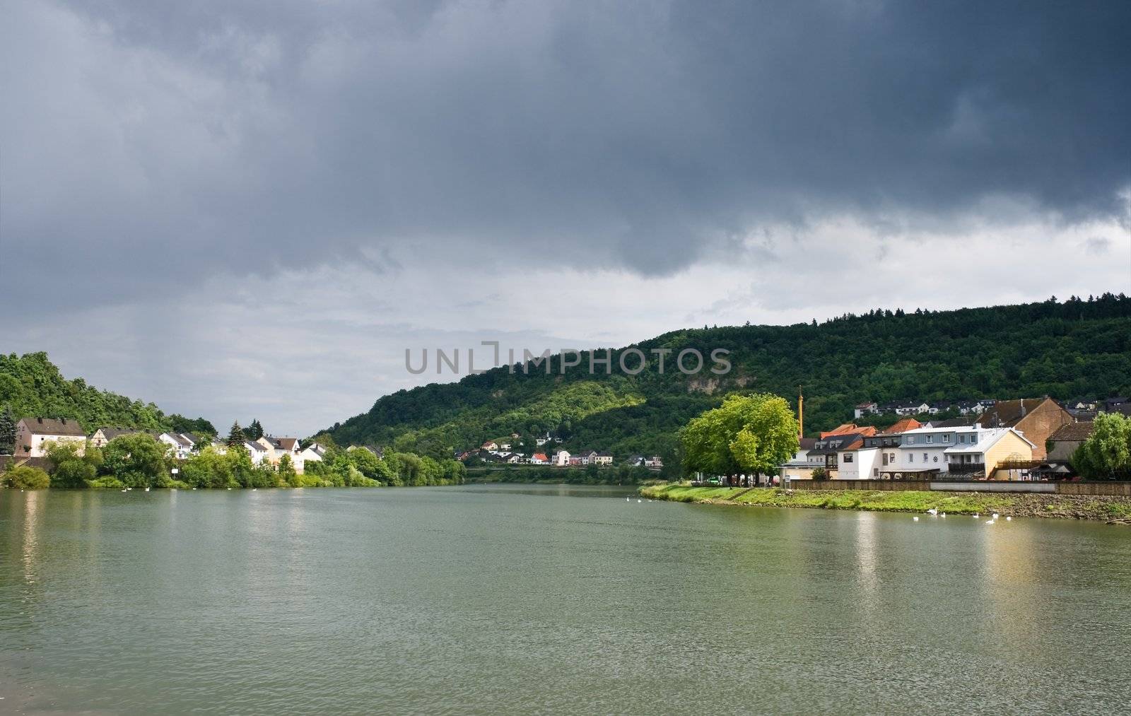 View on river Moezel or Mosel, Luxembourg, Europe in the sunshine in summer just after rainfall