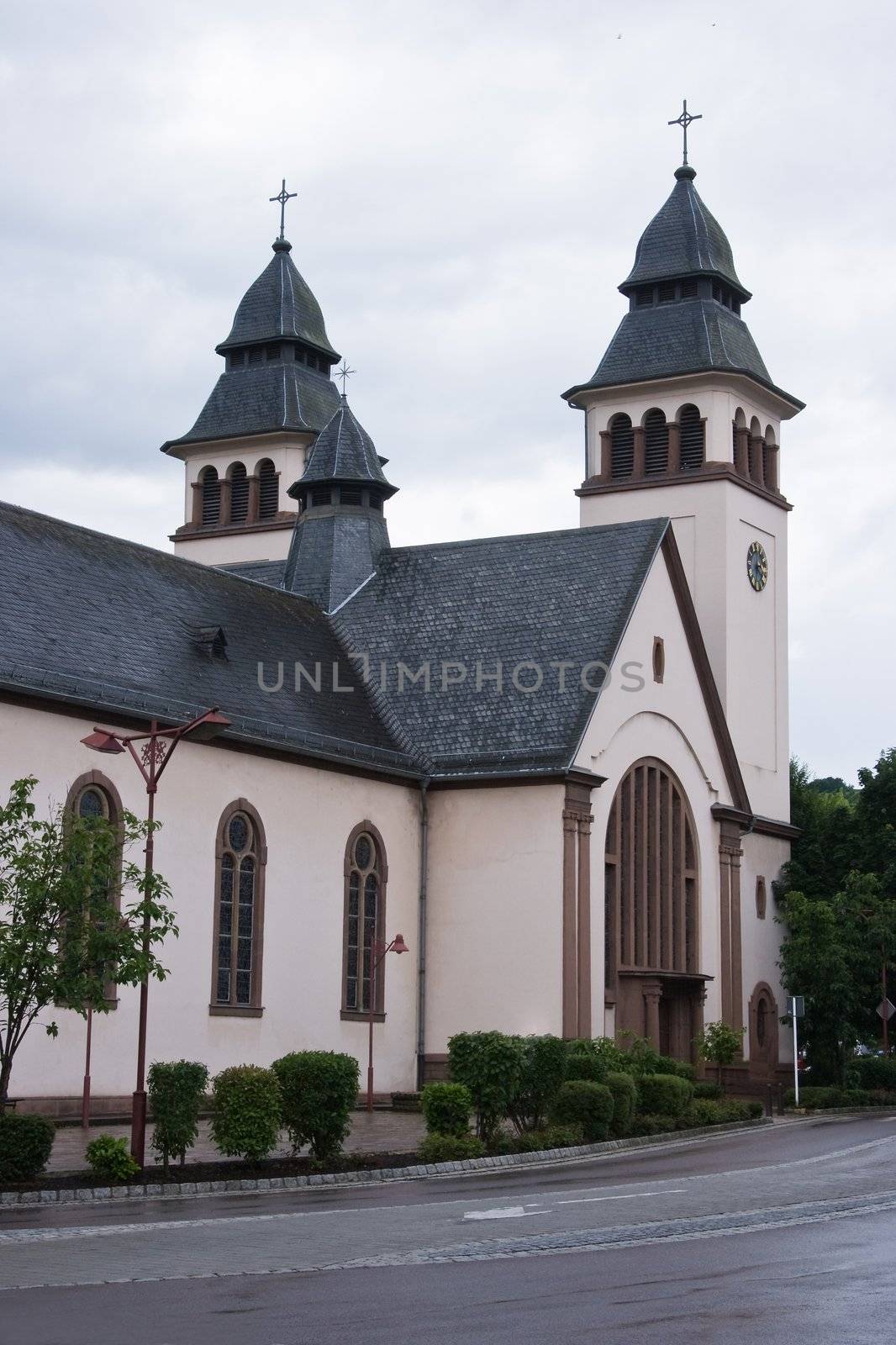 Church in the rain in city Wasserbillig, Luxembourg, Europe