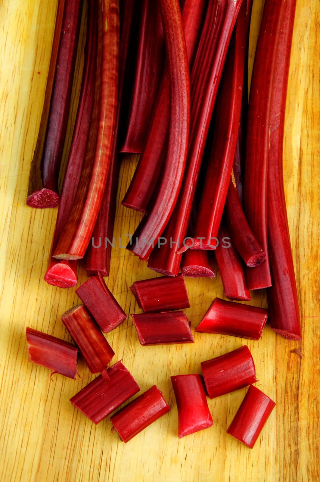 Chopped rhubarb on a wooden plate
