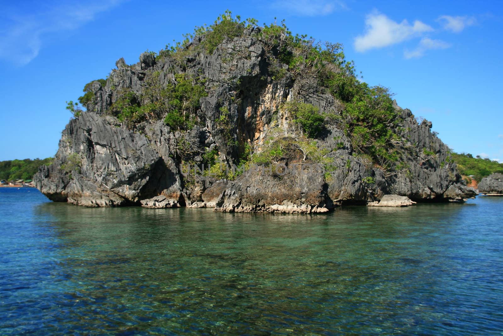 scenic view of a tropical island in a lagoon
