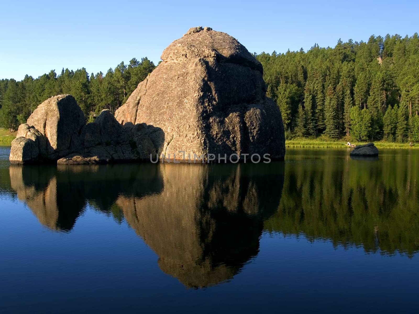 A bright morning view of the large stones in the water of Sylvan Lake in the Black hills of South Dakota.