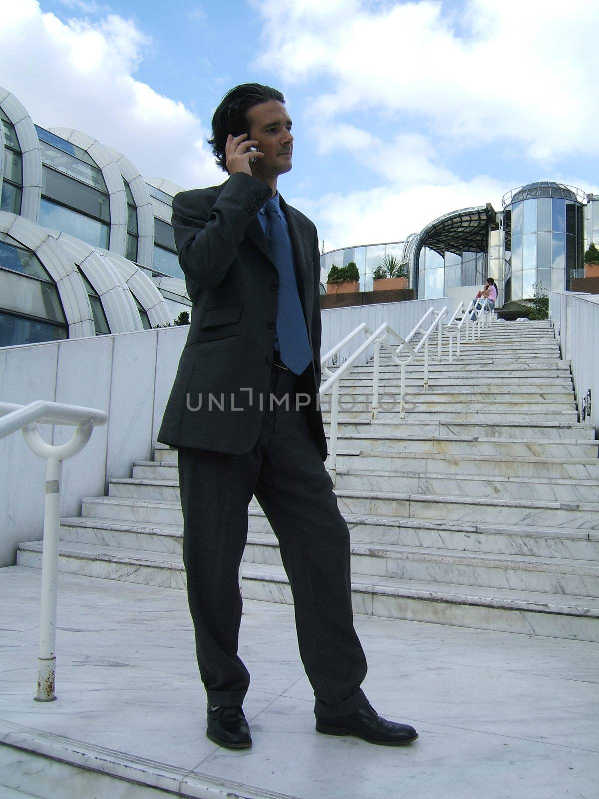 Full body of a businessman phoning