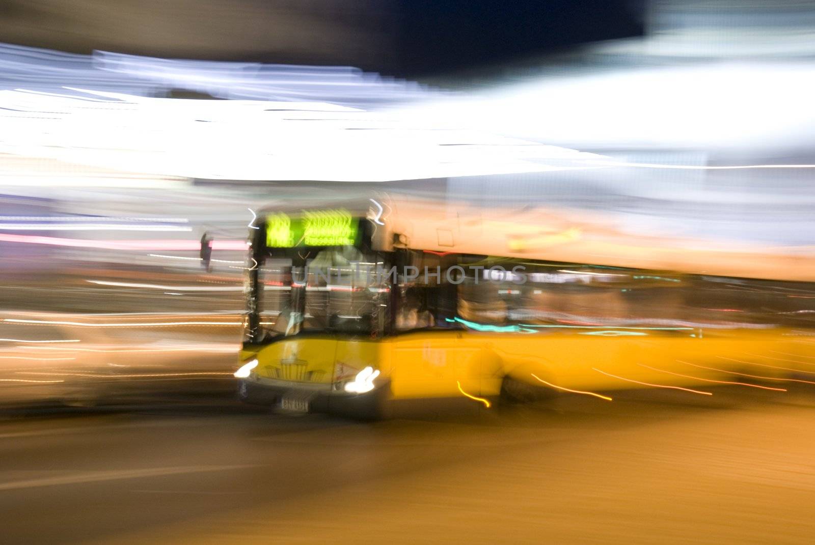 The yellow bus quickly goes on an evening city

