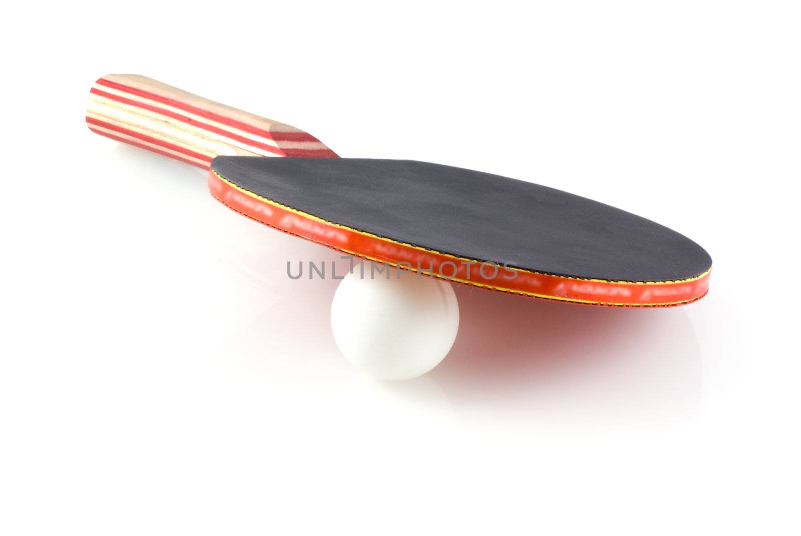 Table tennis bat with ball on a white background.