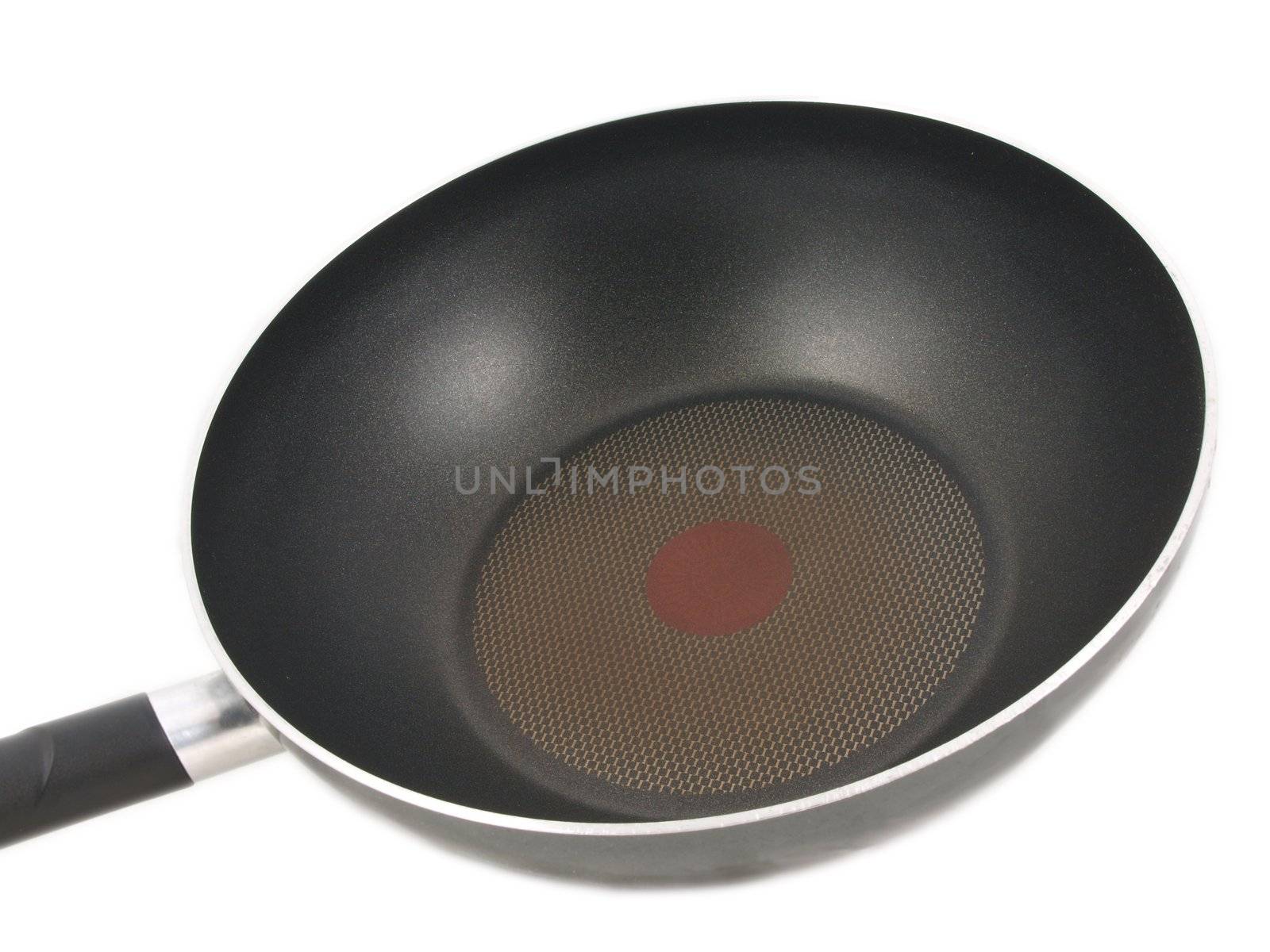 Frying pan with red hot spot isolated towards white background