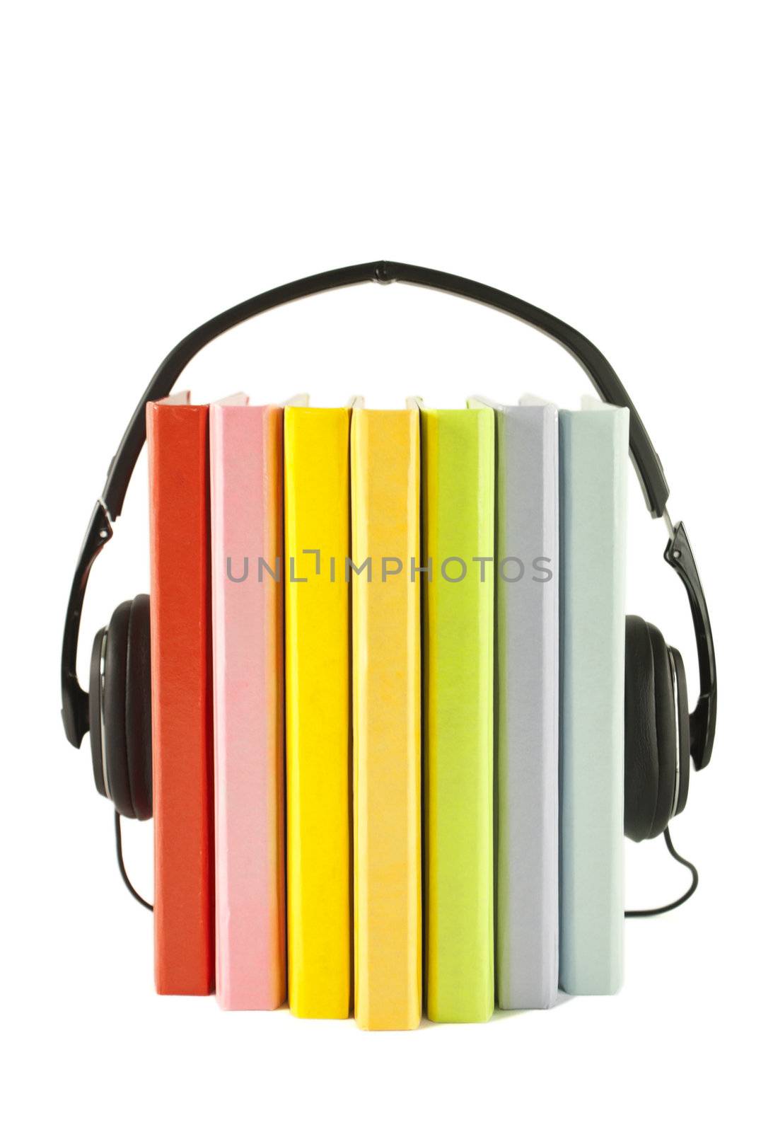 Books with headphones isolated on white. Audiobooks concept