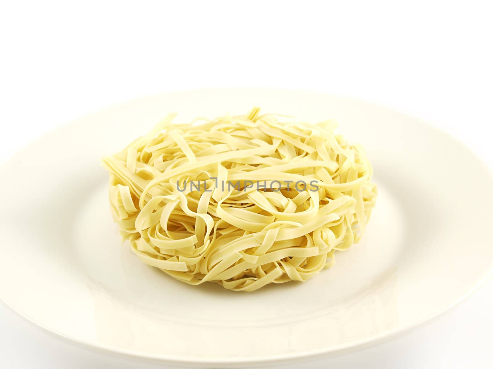 Round noodle, isolated on white plate, towards white background