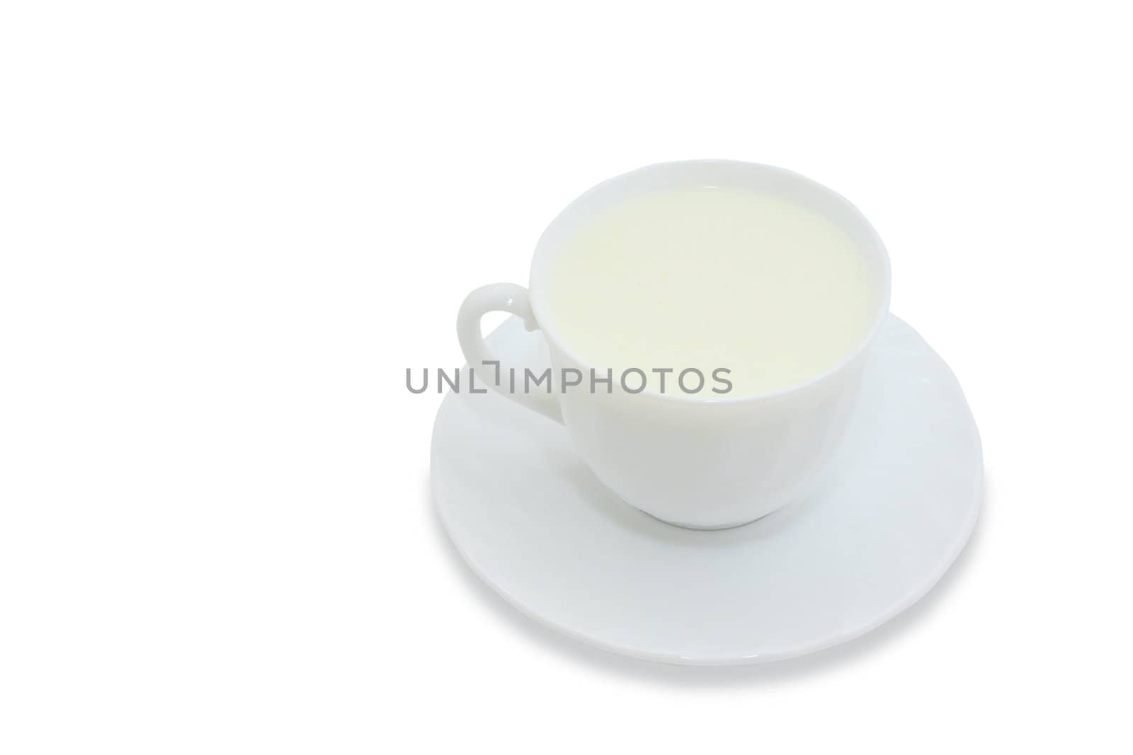 Mug with the milk, standing on a saucer on a white background. With clipping path.