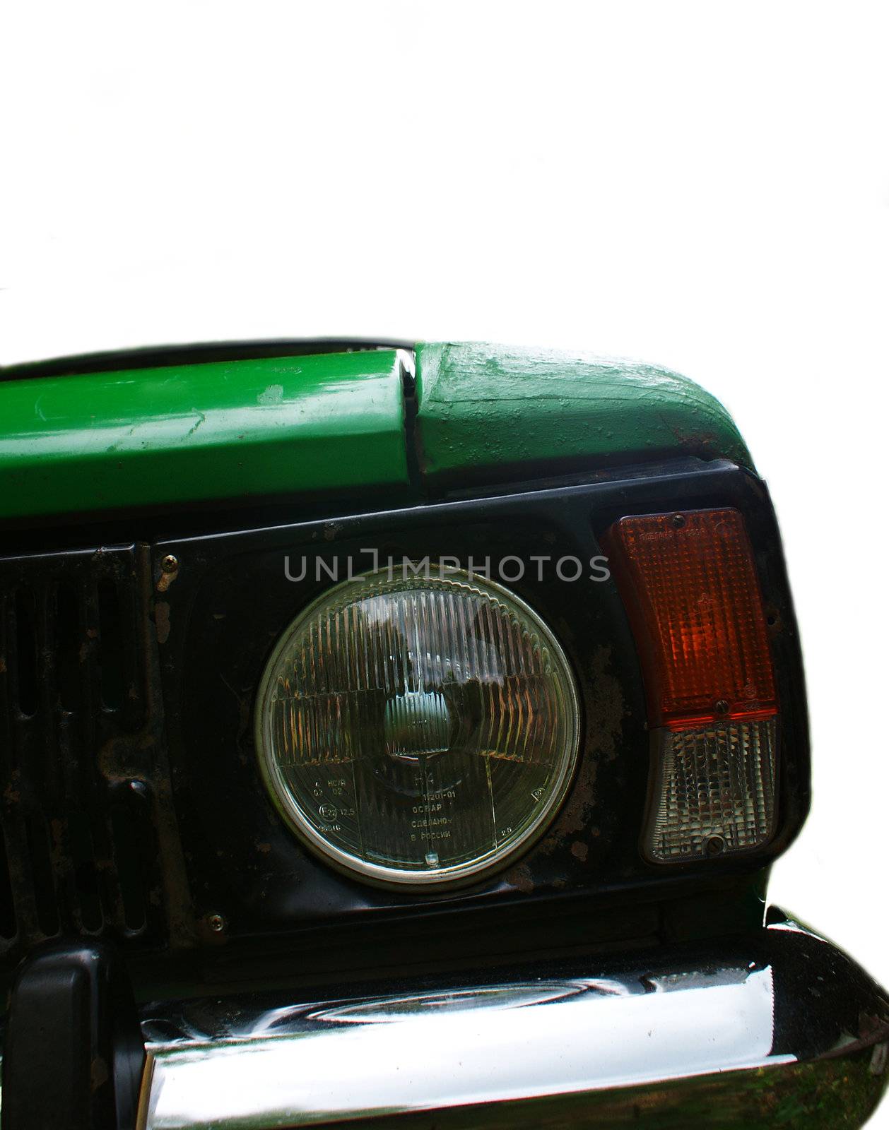 Headlight of an old retro automobile isolated on white background