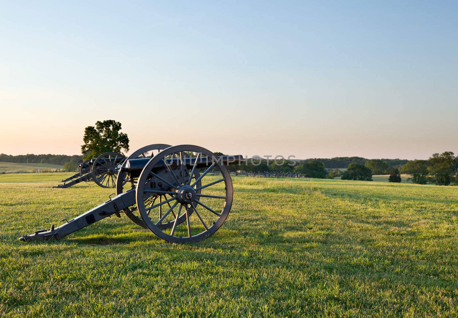 Sunset view of the old cannons in a line at Manassas Civil War battlefield where the Bull Run battle was fought. 2011 is the sesquicentennial of the battle