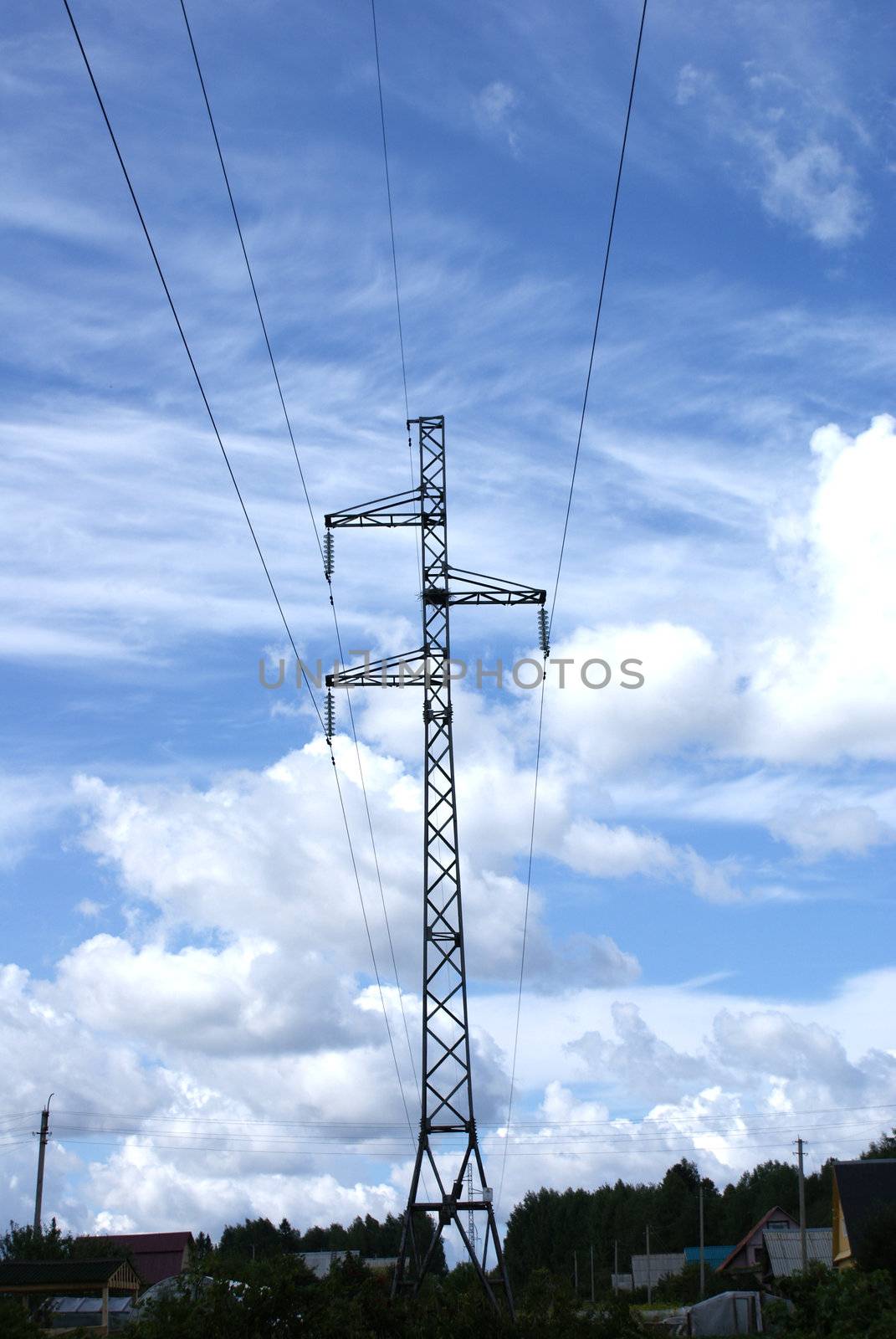 Power supply line in the countryside with blue sky on the background