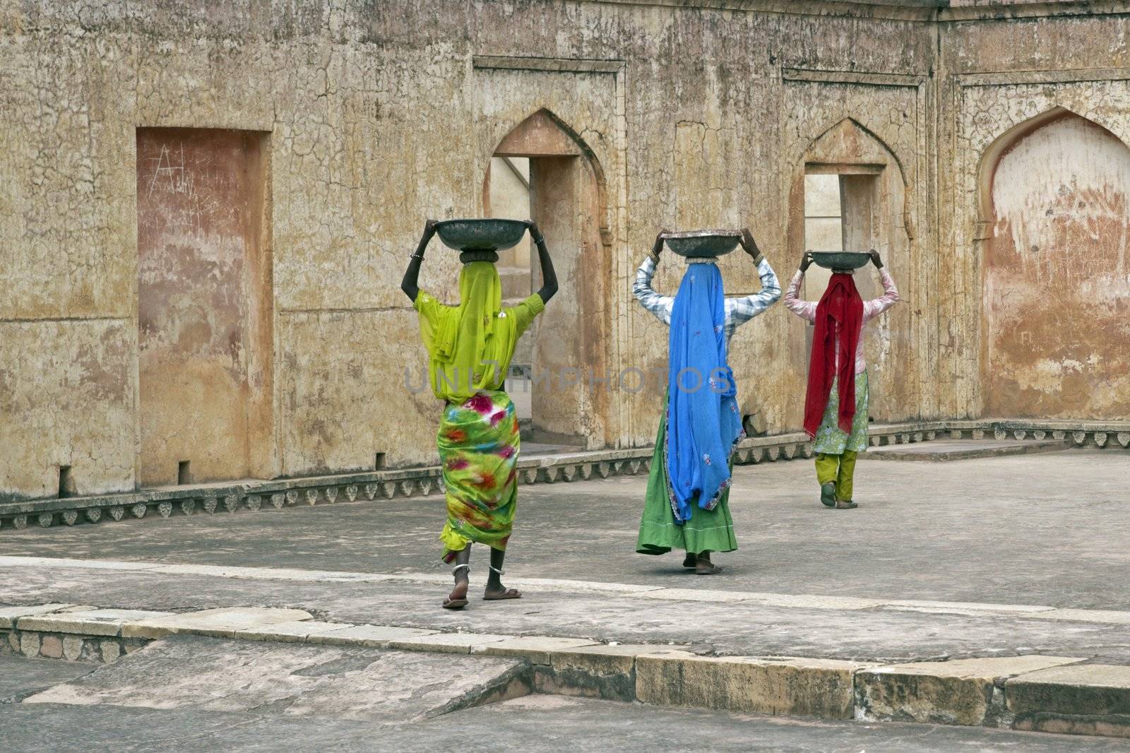 Indian women laborers at work restoring an old palace, Jaipur, Rajasthan, India