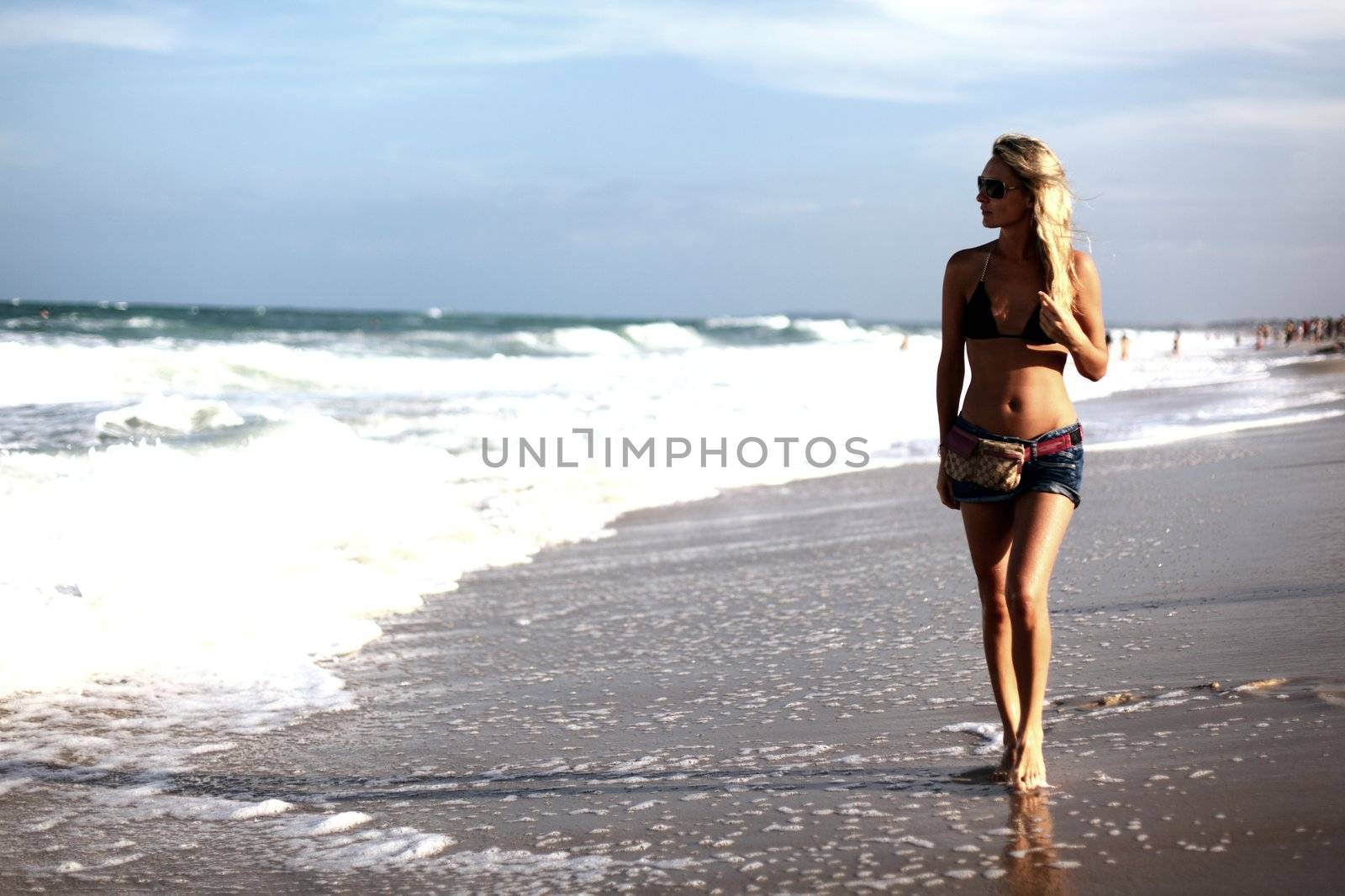 girl walking in the ocean waves