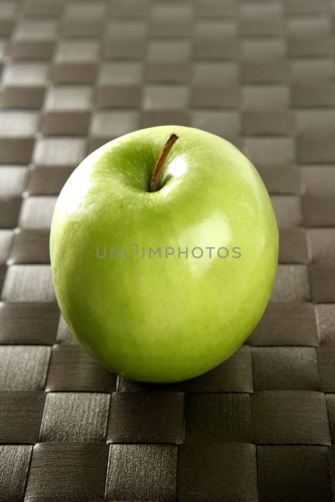 apple on a brown tablecloth by lunamarina