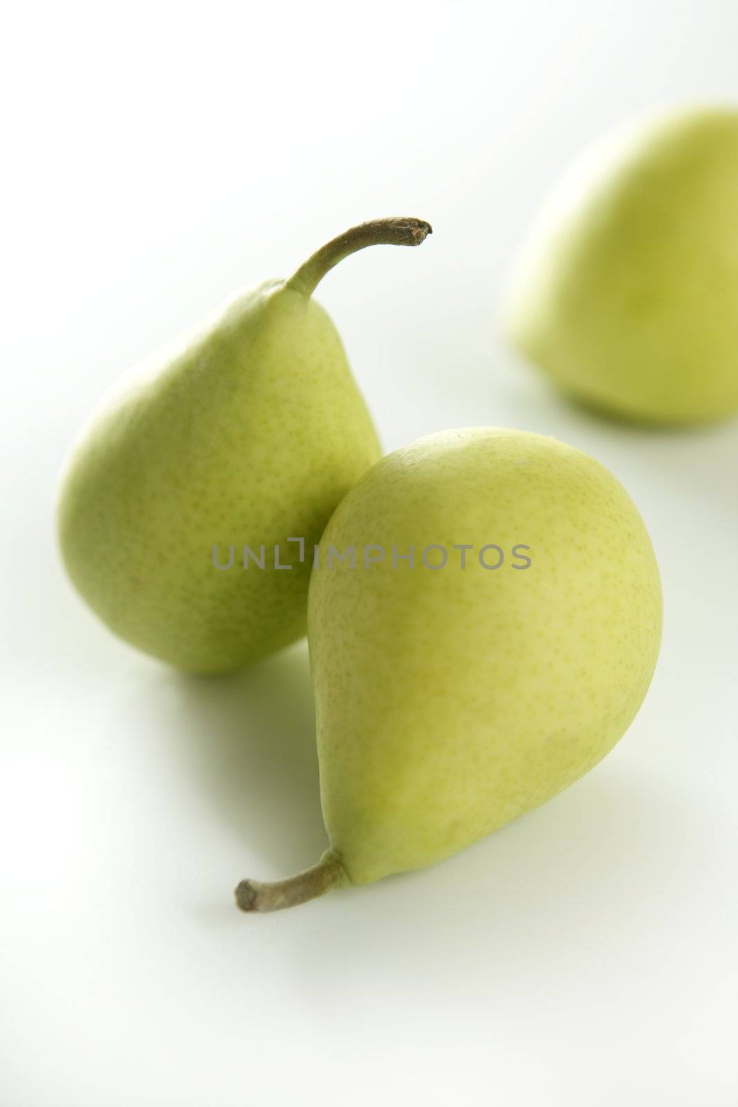 Three pears on white background by lunamarina