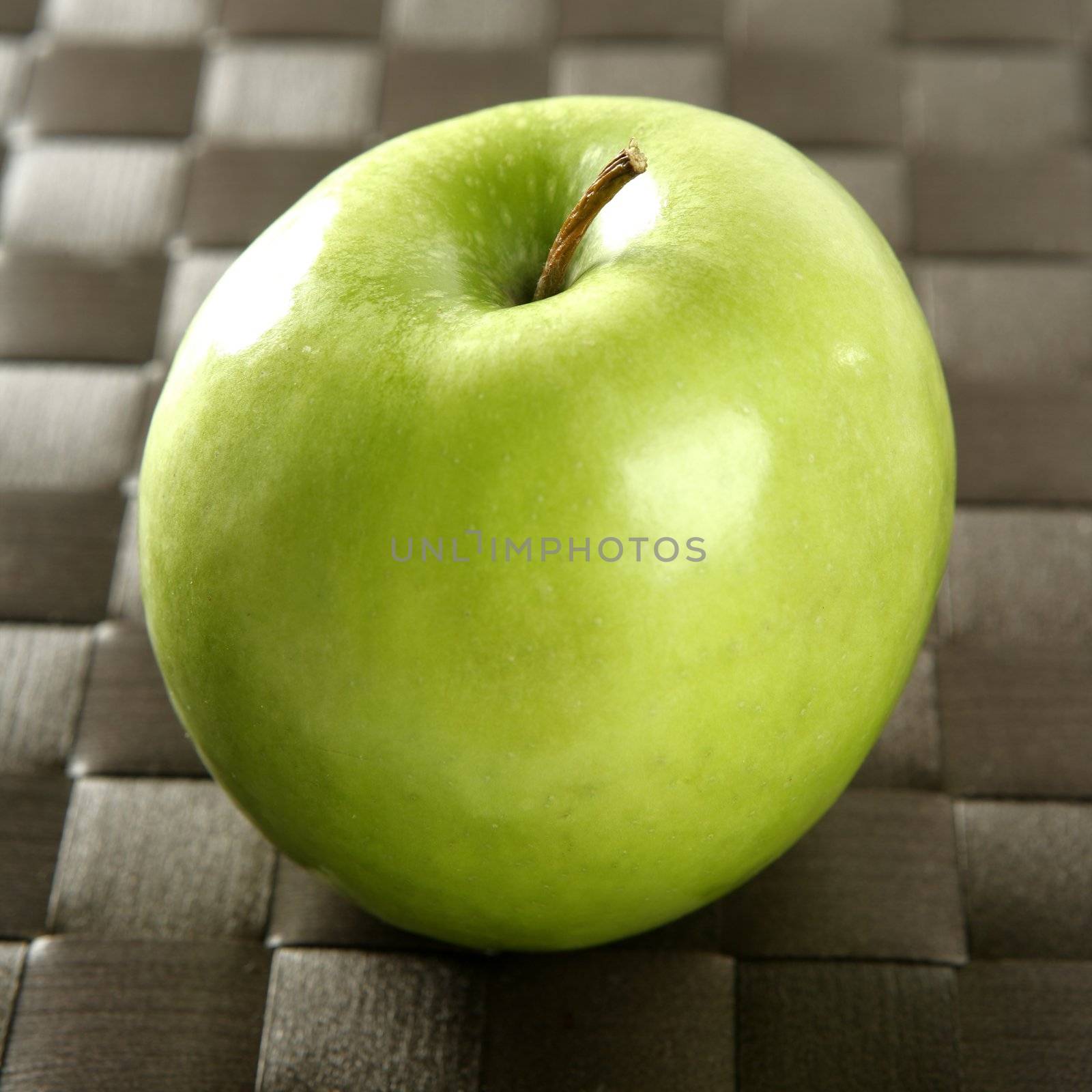 Sweet fruit, apples on a brown tablecloth