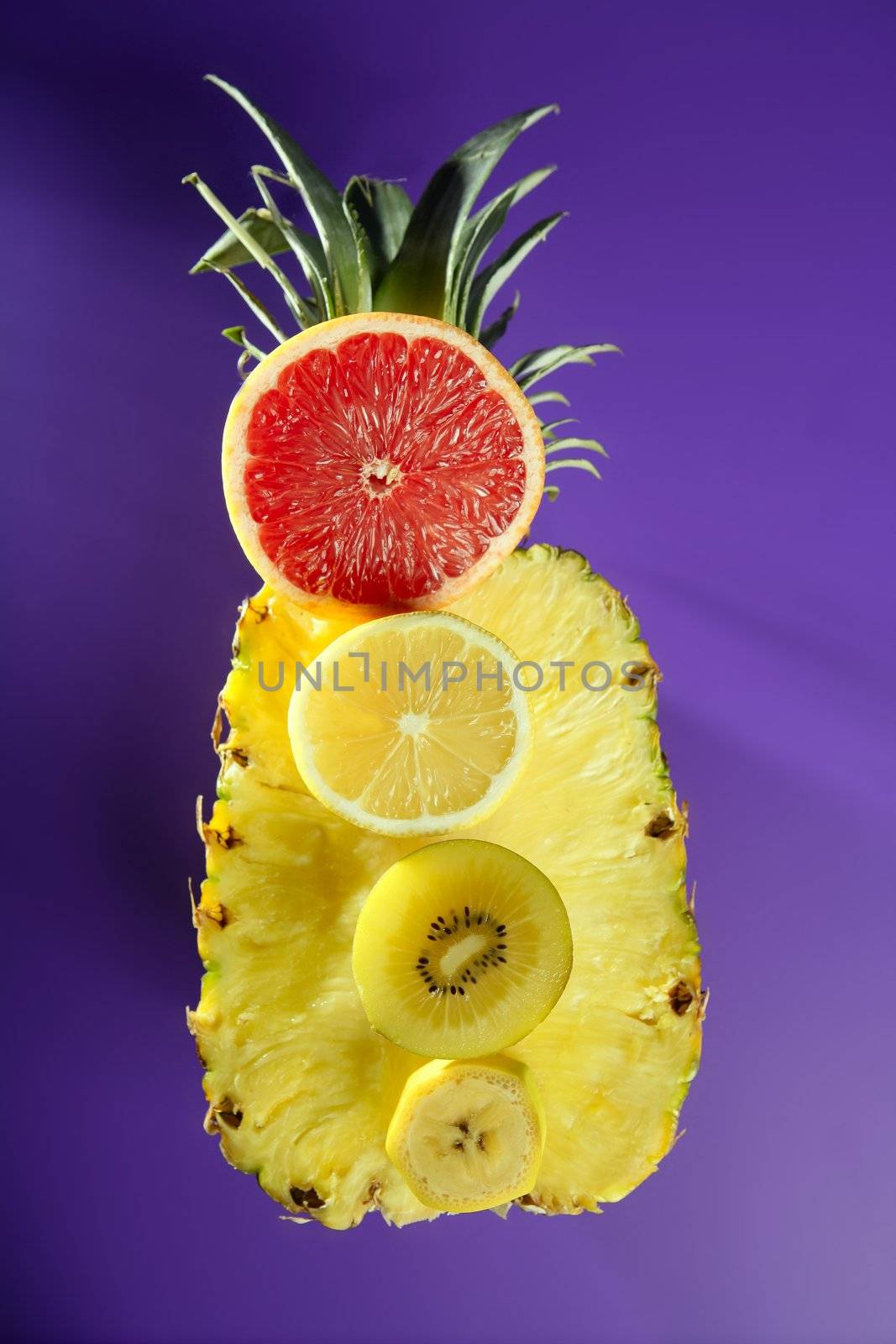 Pineapple with citrus, kiwi and banana slices dessert