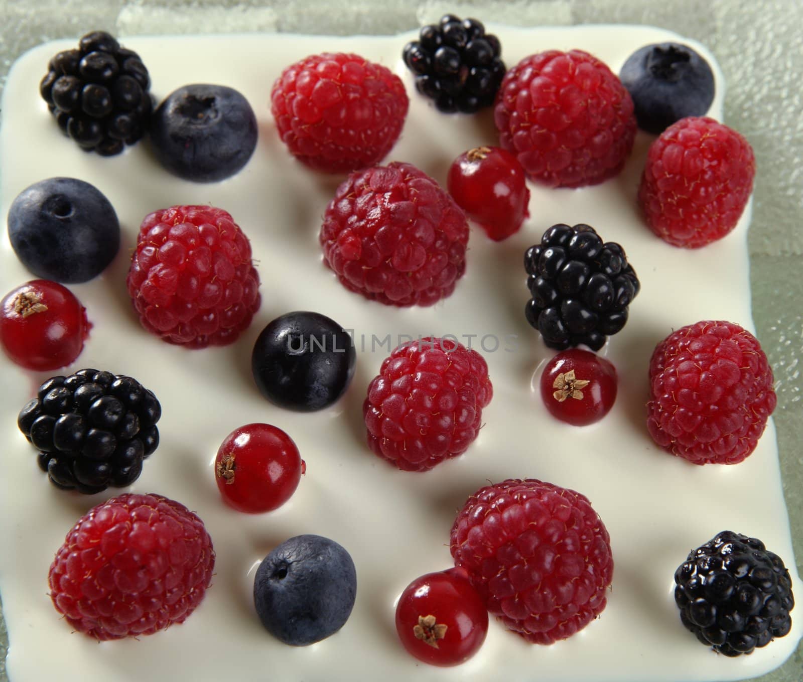 Dessert of mixed and varied berries and cream