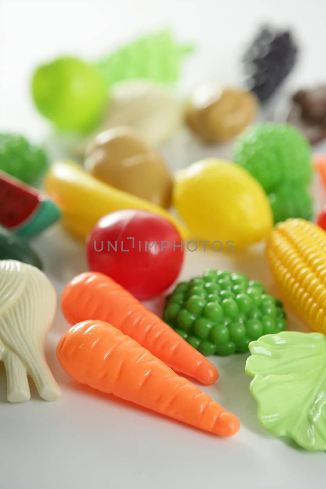 Plastic game, fake varied vegetables and fruits by lunamarina