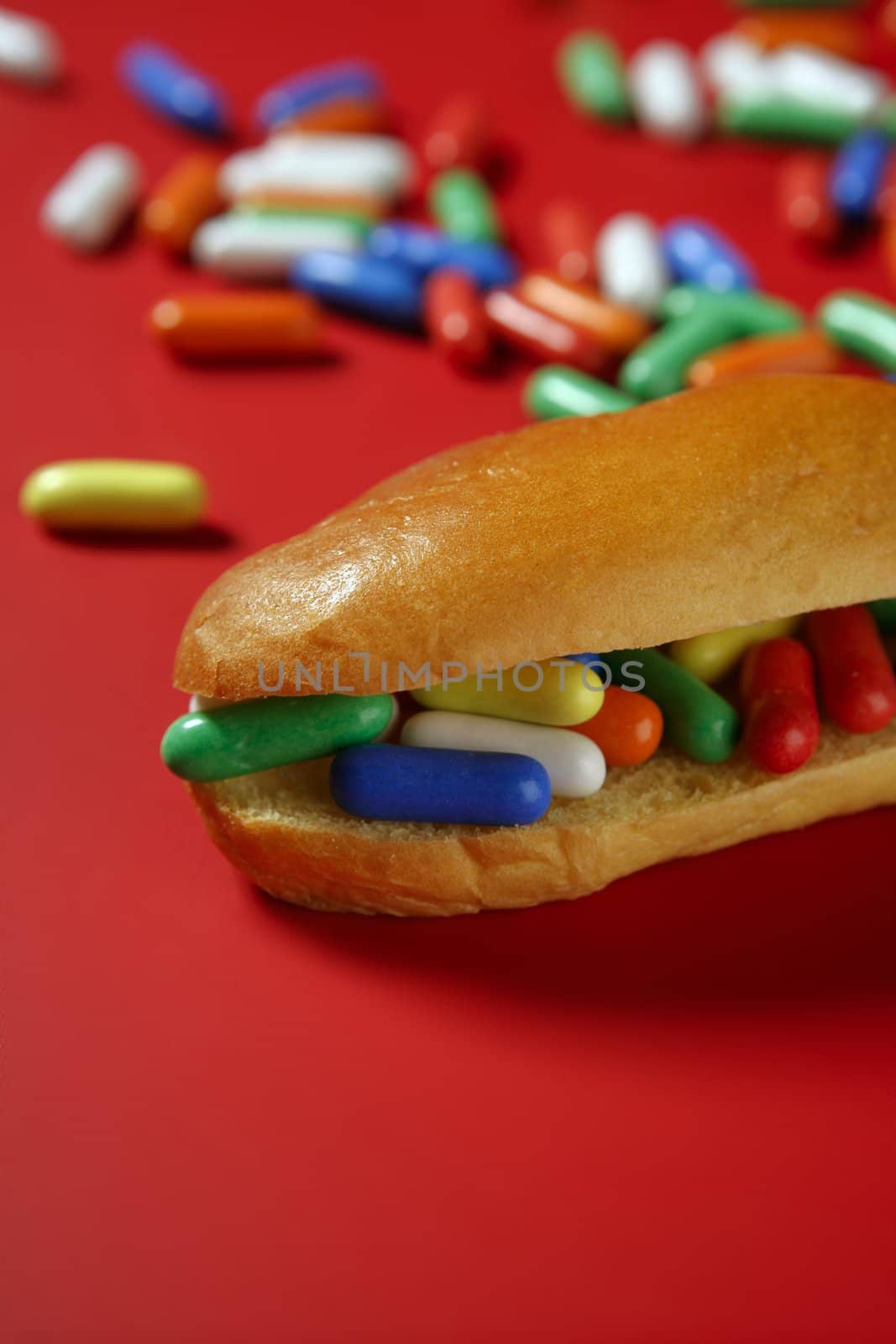 Candy sandwich sweet metaphor over red background