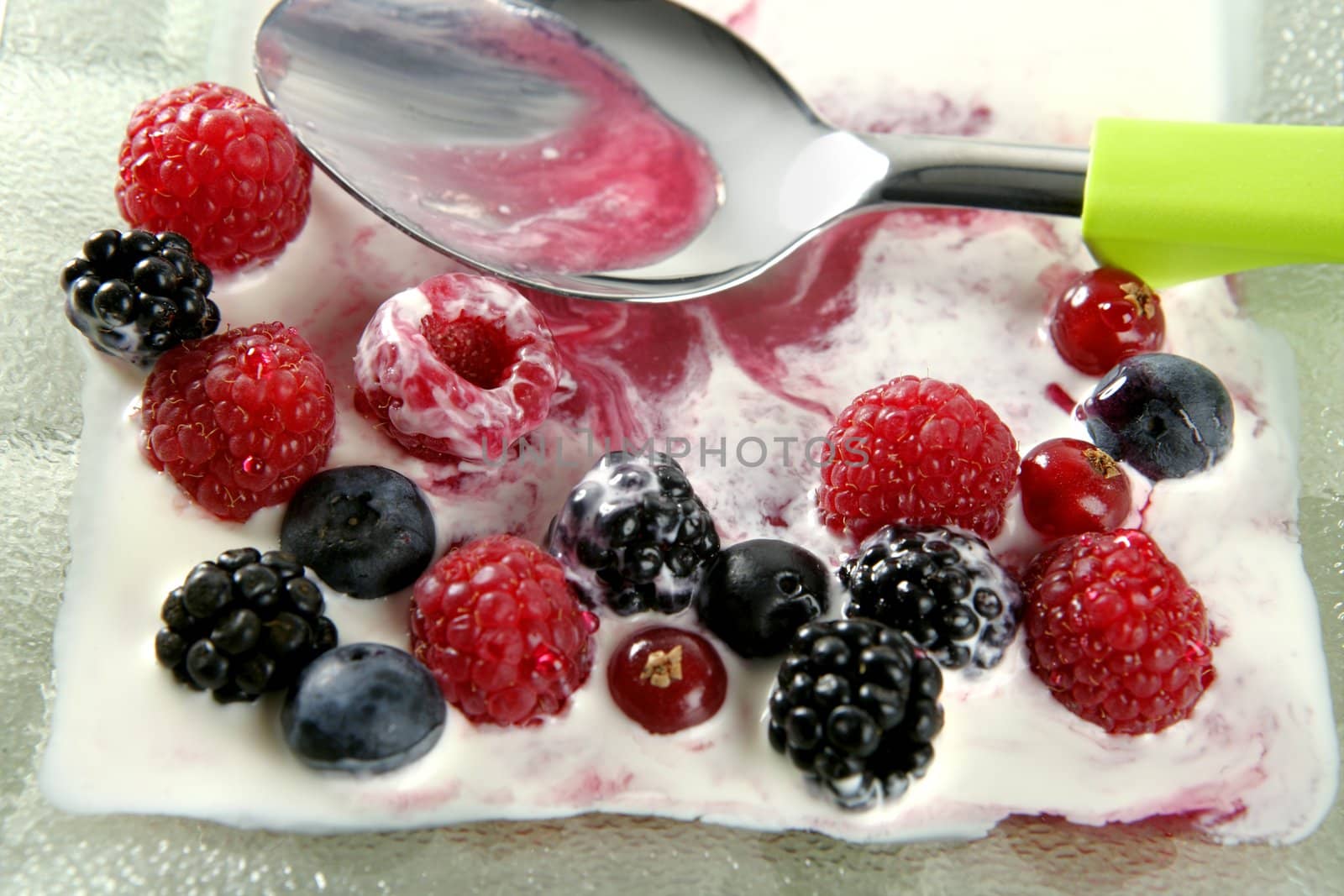 Dessert of mixed and varied berries and cream